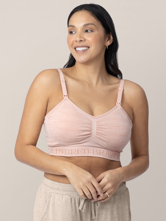Close up of a model wearing the Sublime® Hands-Free Pumping & Nursing Bra in Pink Heather@model_info:Julana is wearing a Small.