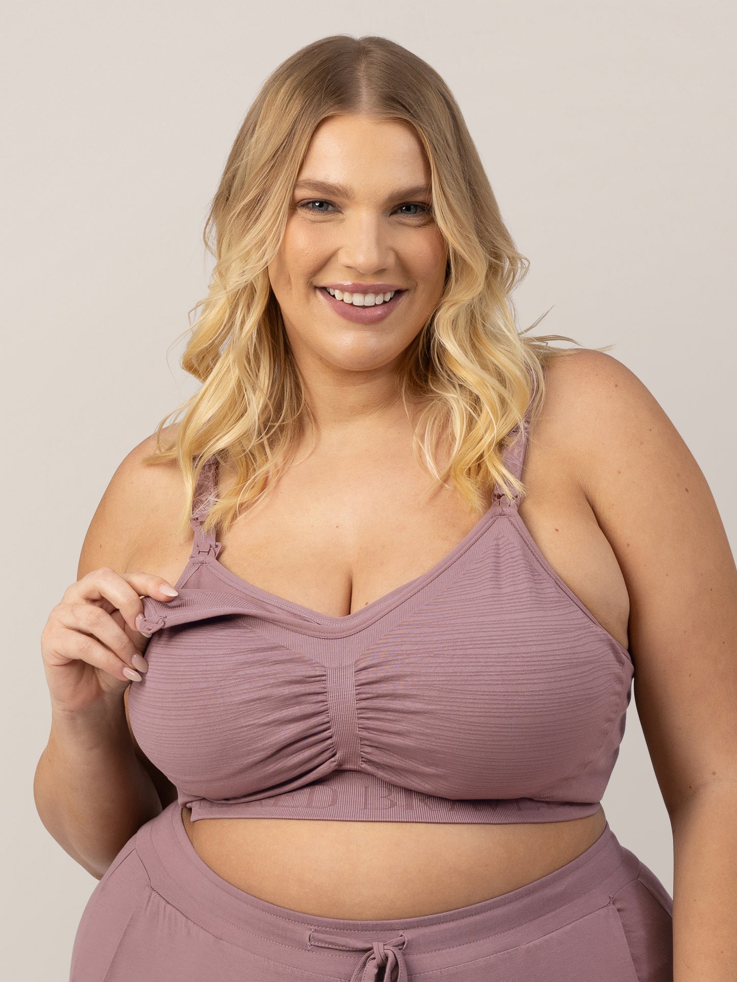 Model showing the clip down pumping access on the Sublime® Hands-Free Pumping & Nursing Bra in Twilight