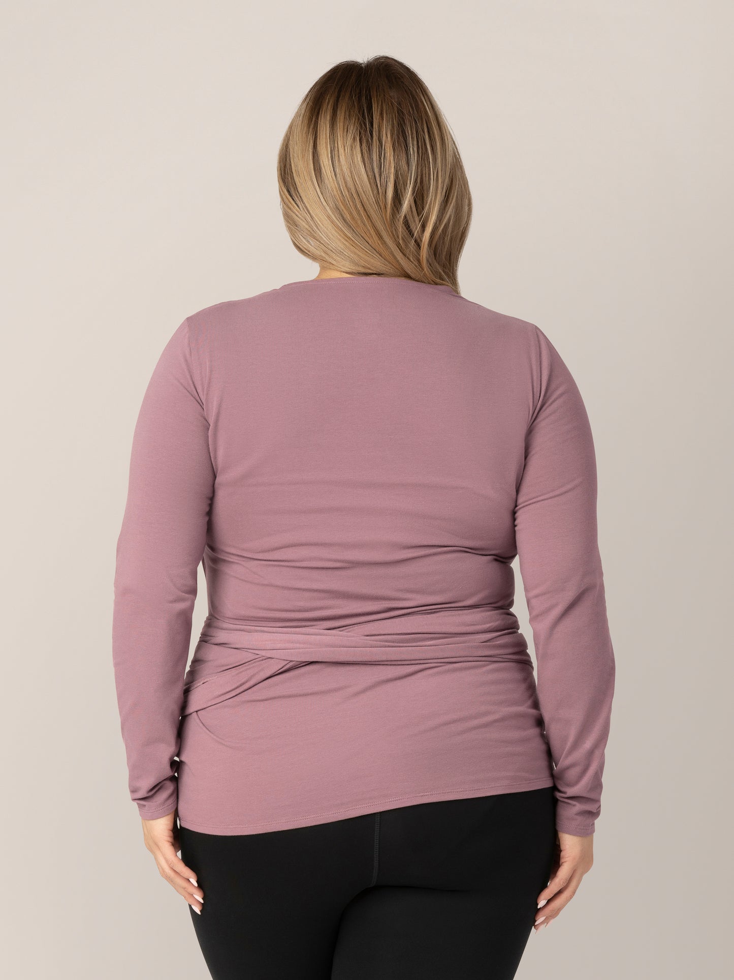 Back view of model wearing the Organic Cotton Skin to Skin Long Sleeve Wrap Top in Twilight.