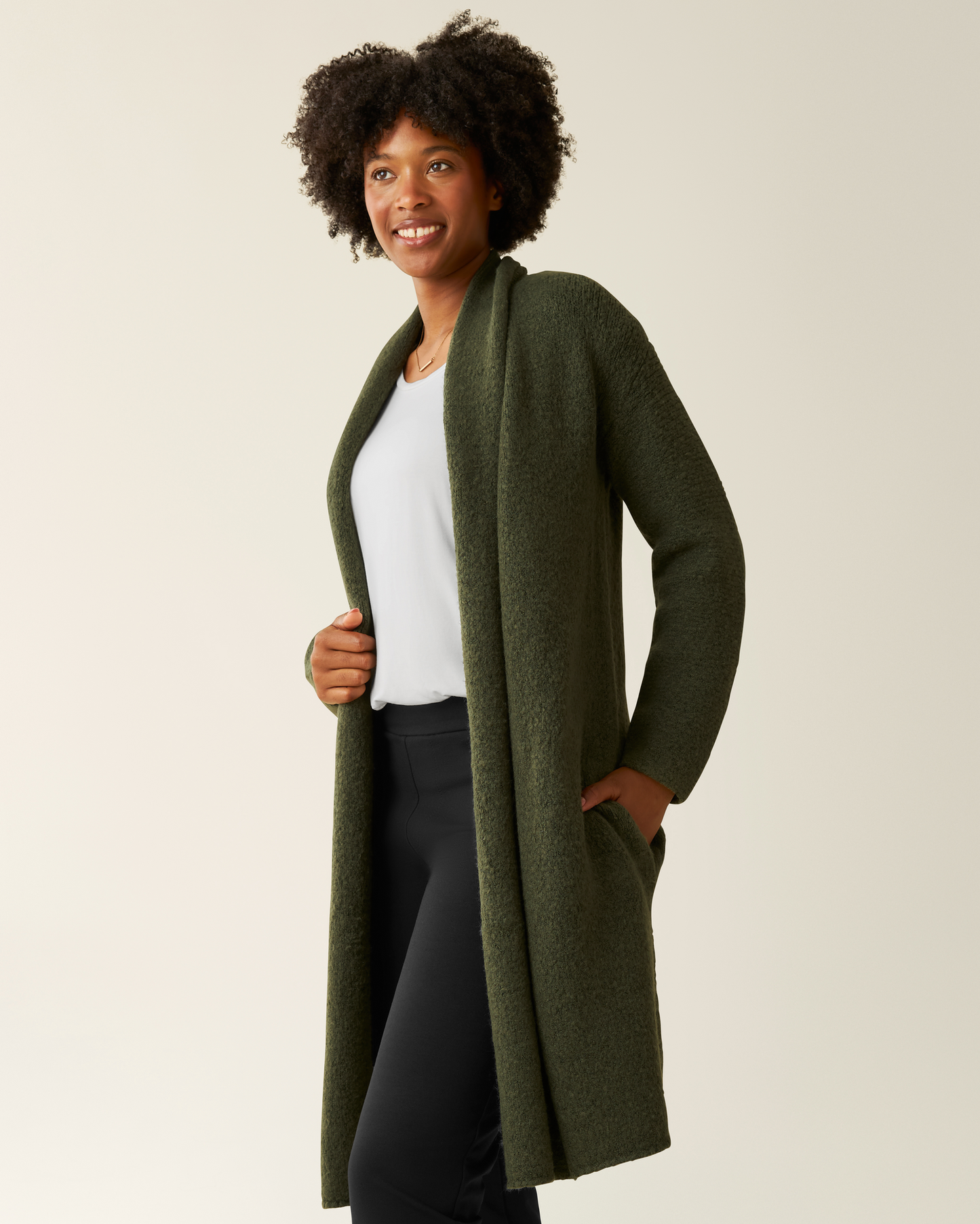 Side view of woman wearing the Chloe Cardigan Sweater in Ecru 
