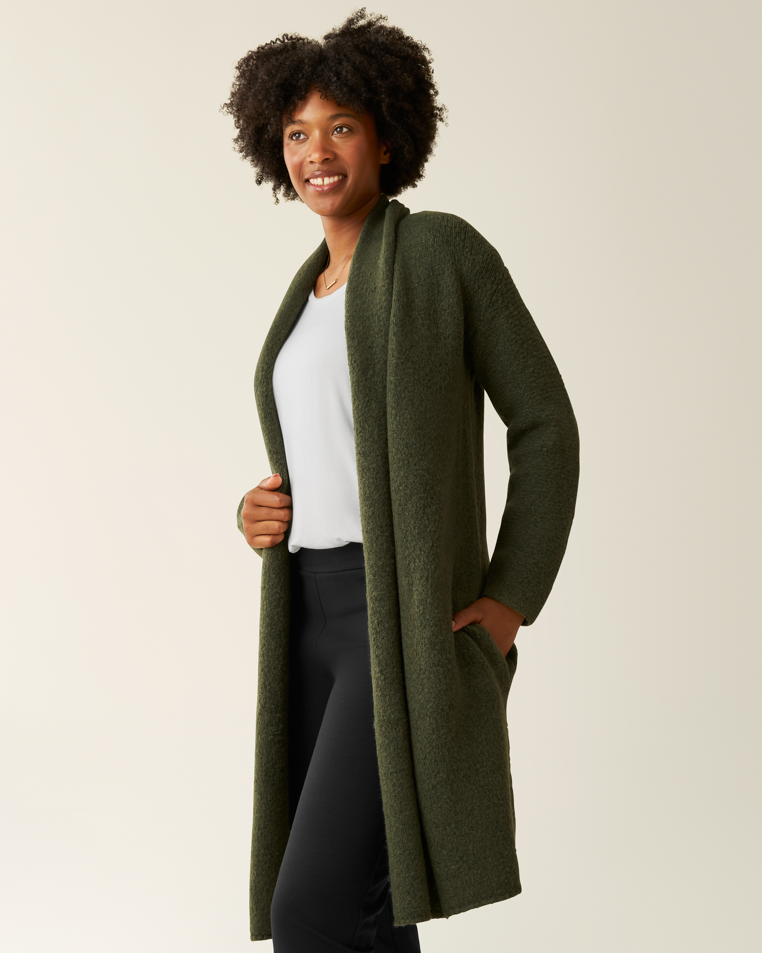 Side view of woman wearing the Chloe Cardigan Sweater in Ecru 