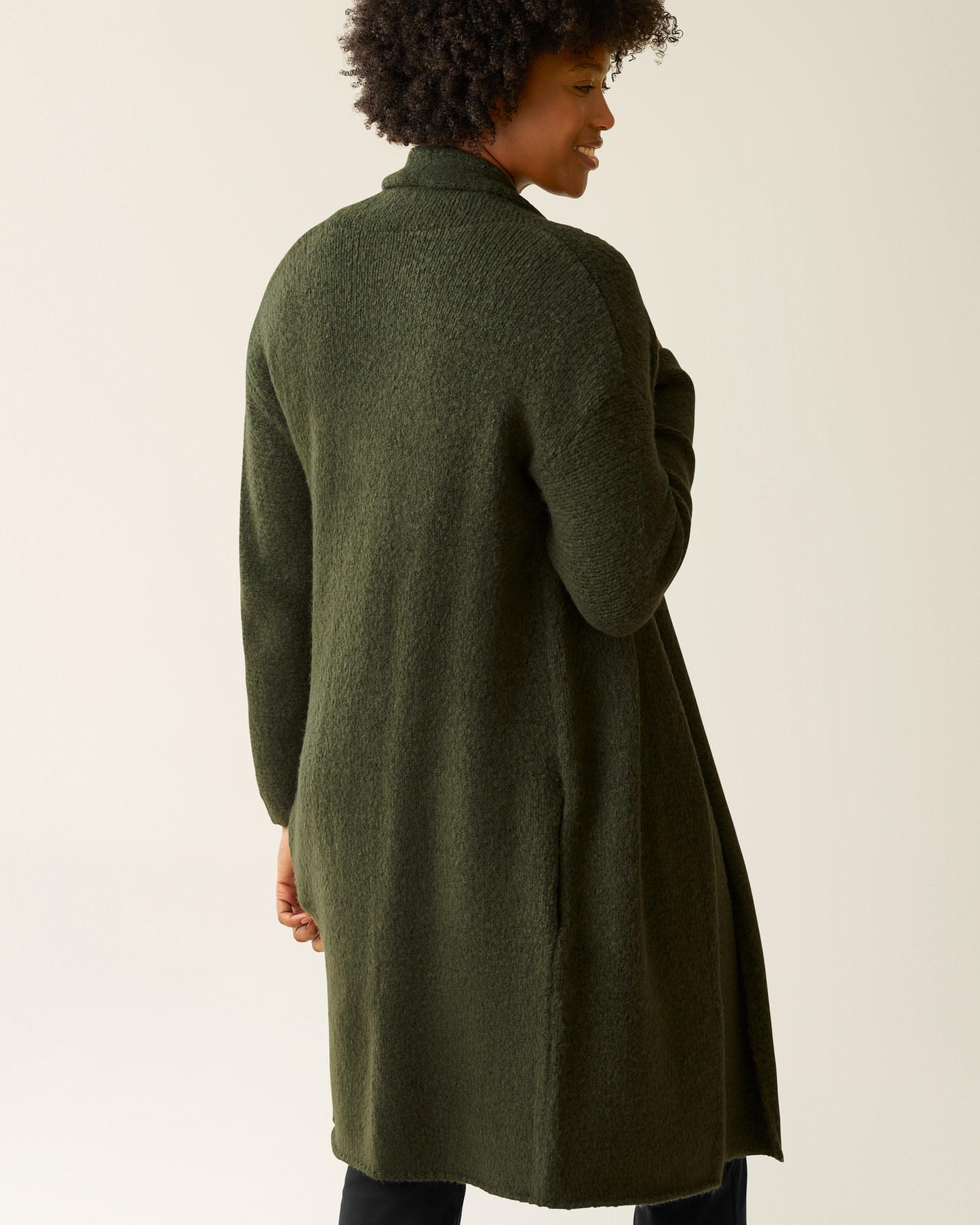 Back view of woman wearing the Chloe Cardigan Sweater in Ecru 