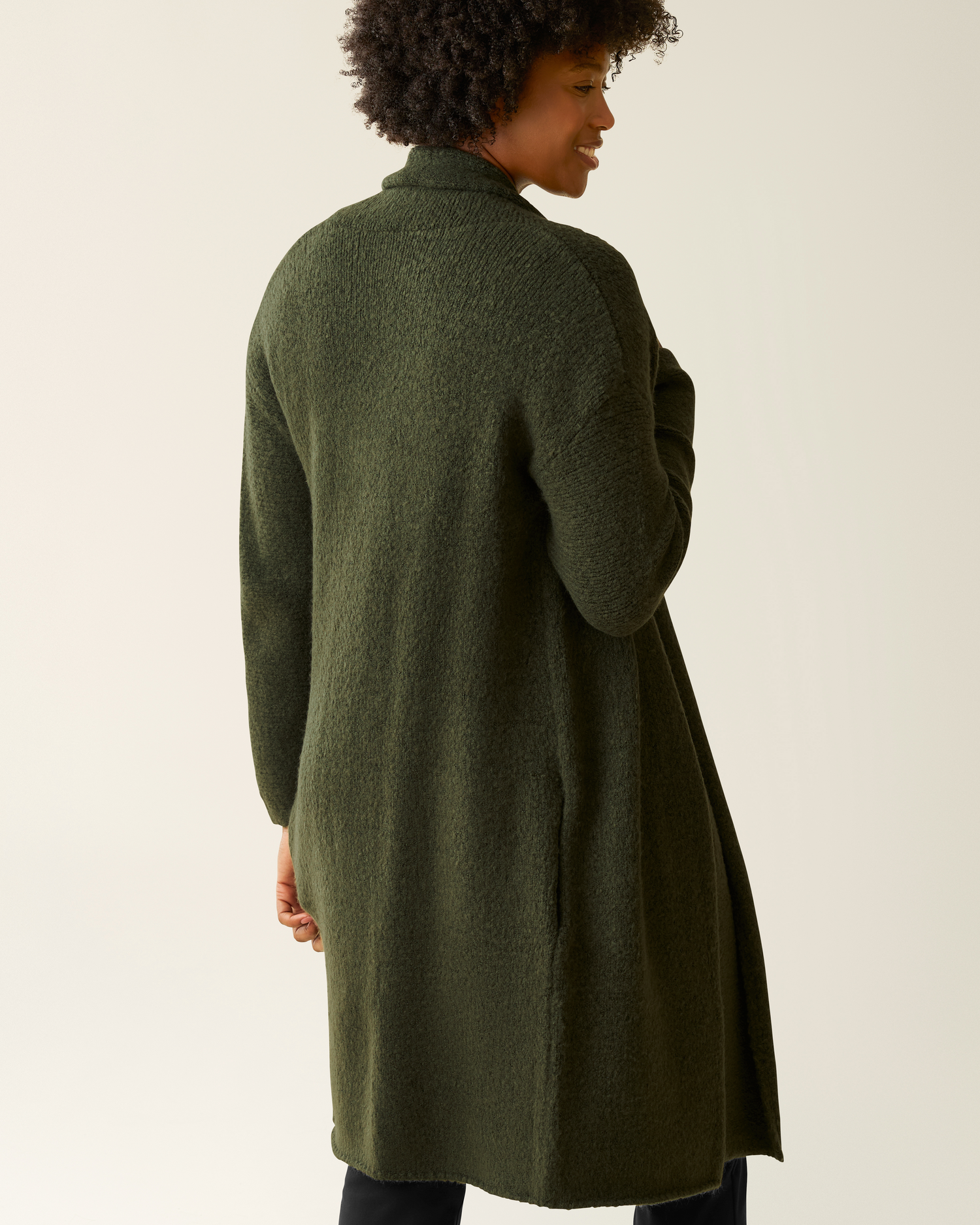 Back view of woman wearing the Chloe Cardigan Sweater in Ecru 