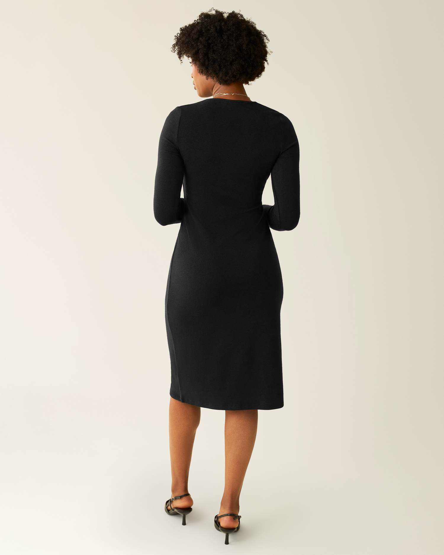 Back view of model wearing Kate Nursing Wrap Sweater Dress in Black