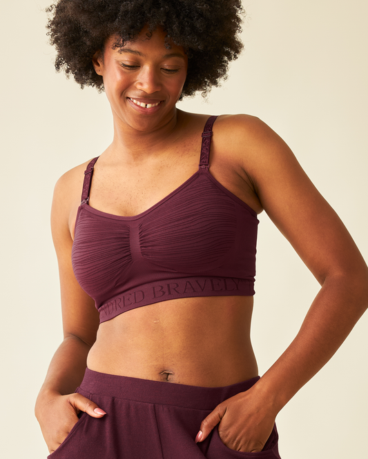 Front view of model wearing Sublime® Hands-Free Pumping & Nursing Bra in Deep Burgundy @model_info:Kyra is wearing a Small.