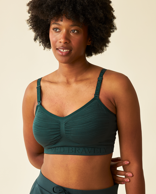 Front view of model wearing Sublime® Hands-Free Pumping & Nursing Bra in Evergreen @model_info:Kyra is wearing a Small.