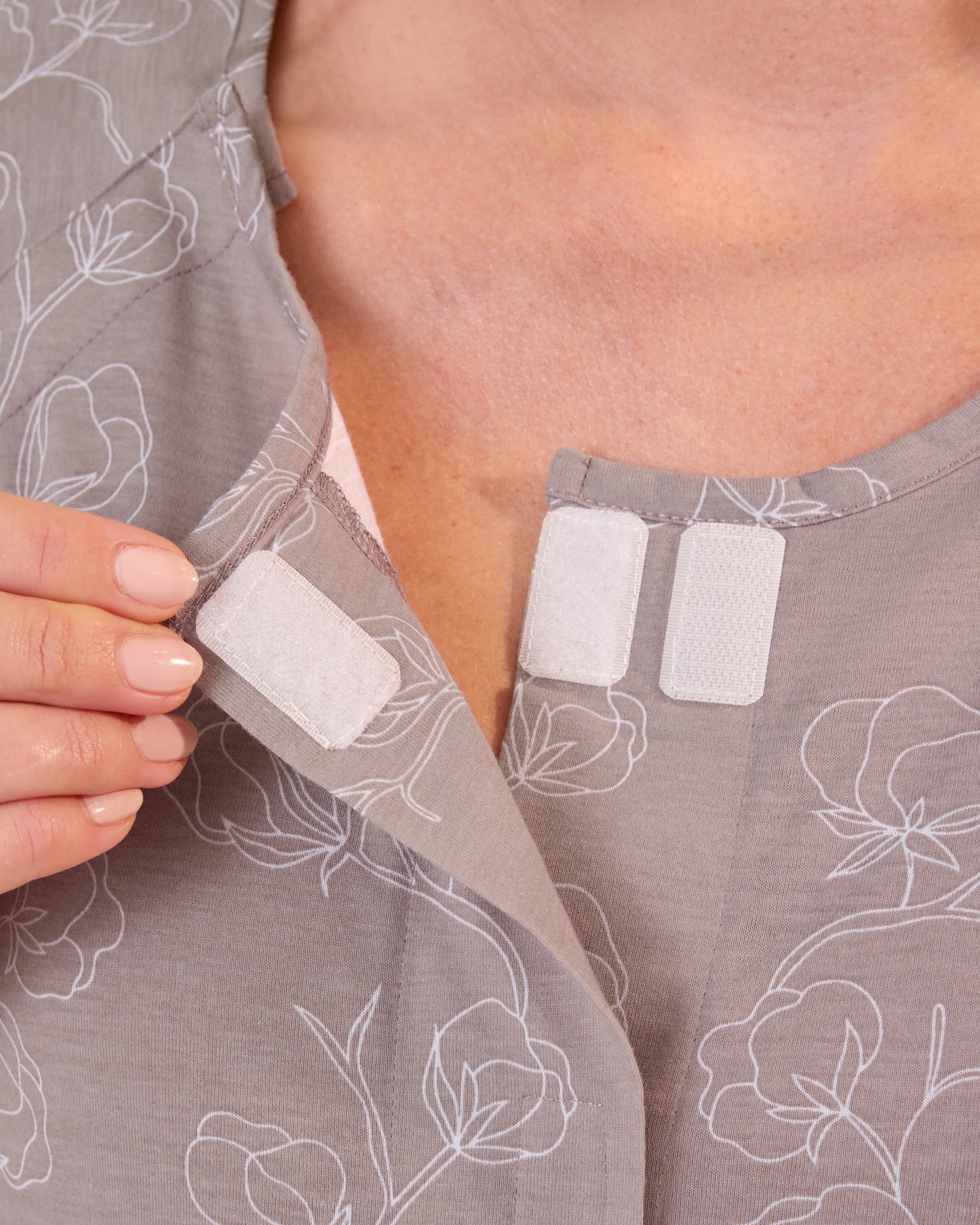 Pregnant woman wearing the Universal Labor & Delivery Gown in Lilac Bloom, showing velcro at top