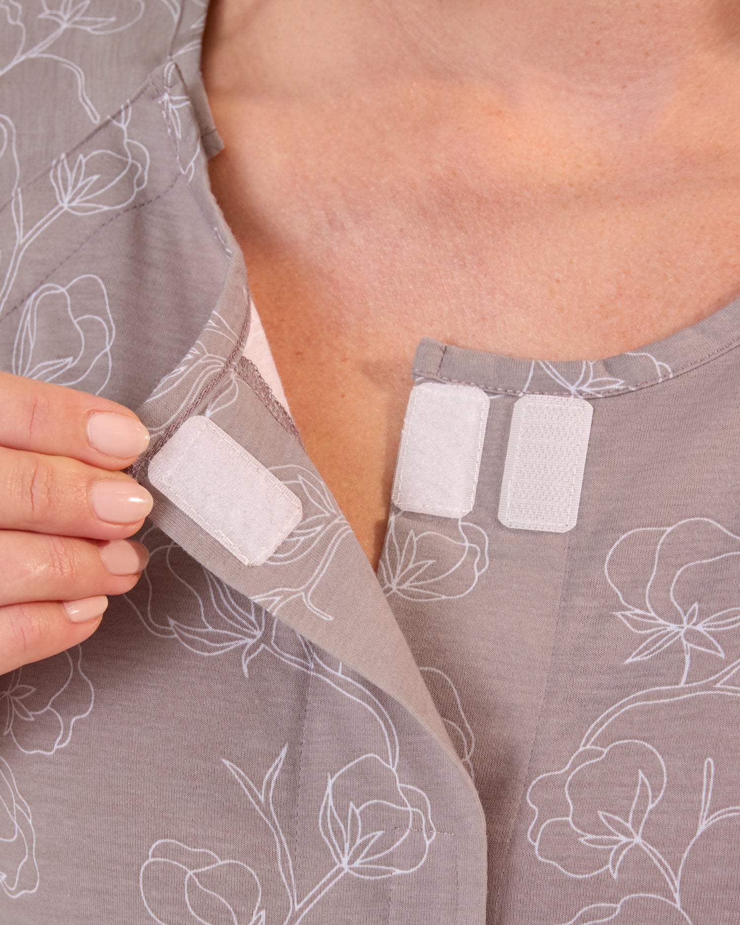 Pregnant woman wearing the Universal Labor & Delivery Gown in Lilac Bloom, showing velcro at top