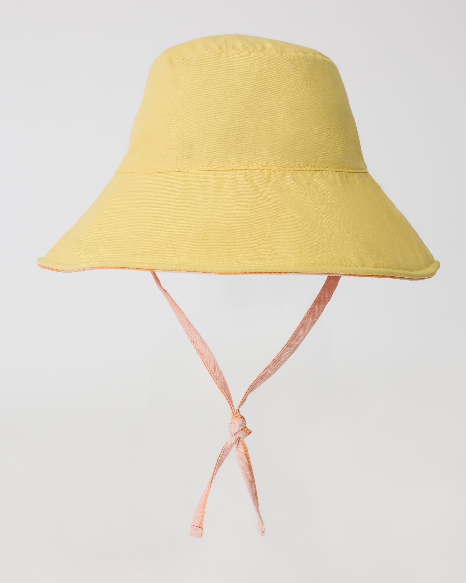 Reverse view of Toddler Sun Hat in Pink Wide Stripe on a beige background
