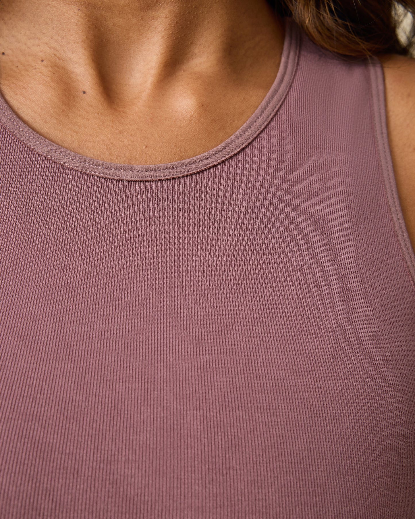 Close up of model wearing the Sublime® Bamboo Maternity & Nursing Longline Bra in Twilight, on a beige background.