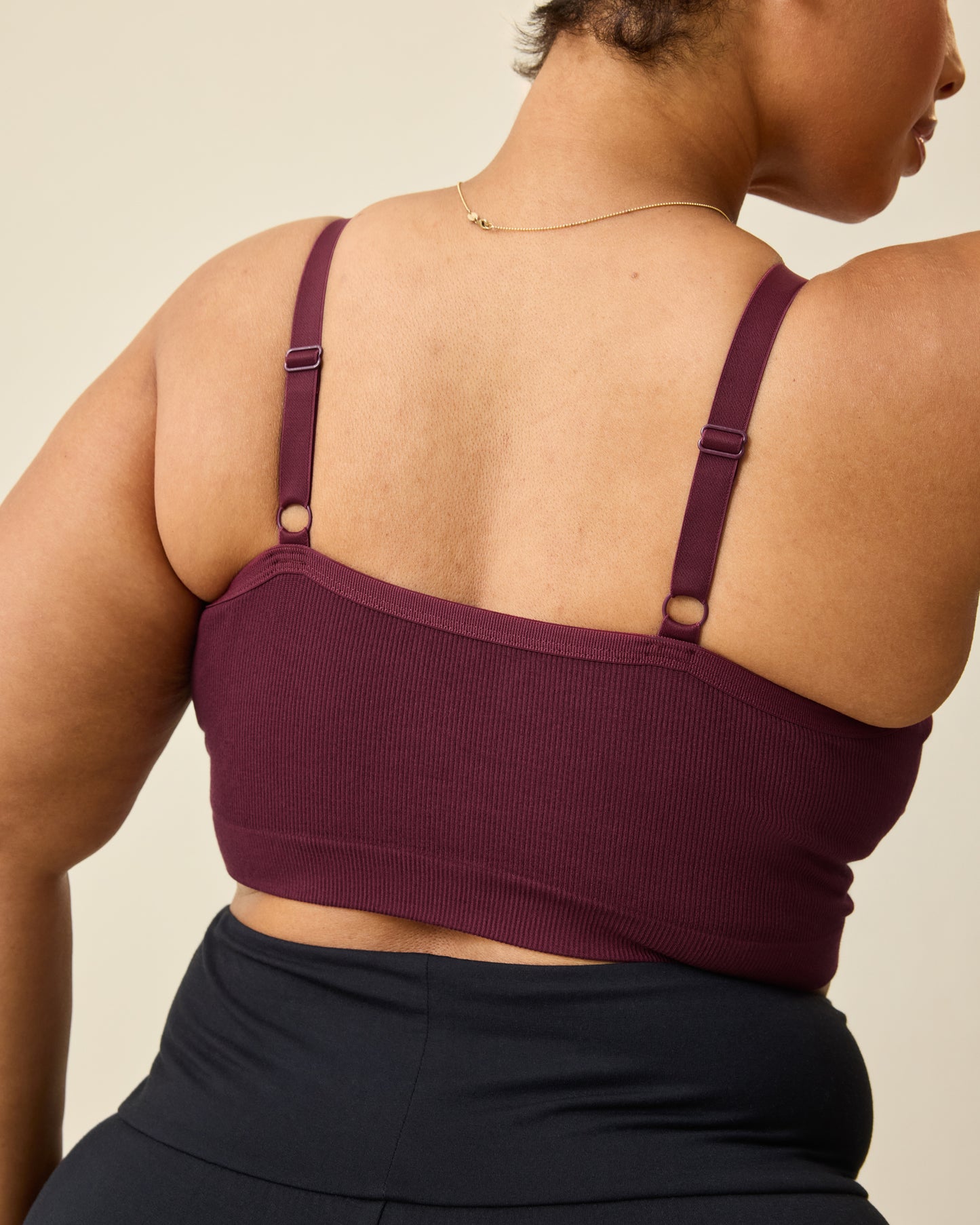 Woman wearing the Sublime® Bamboo Hands-Free Pumping Lounge & Sleep Bra in Deep Burgundy, showing back of bra.