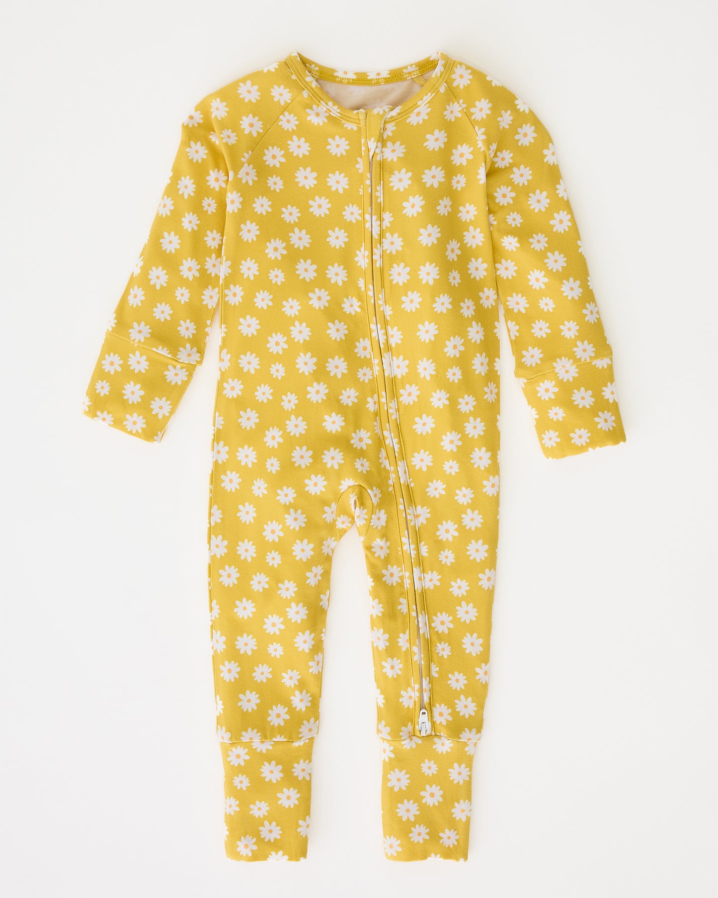 Bamboo Baby Pajama in Yellow Daisies on a beige background