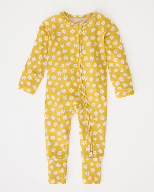Bamboo Baby Pajama in Yellow Daisies on a beige background