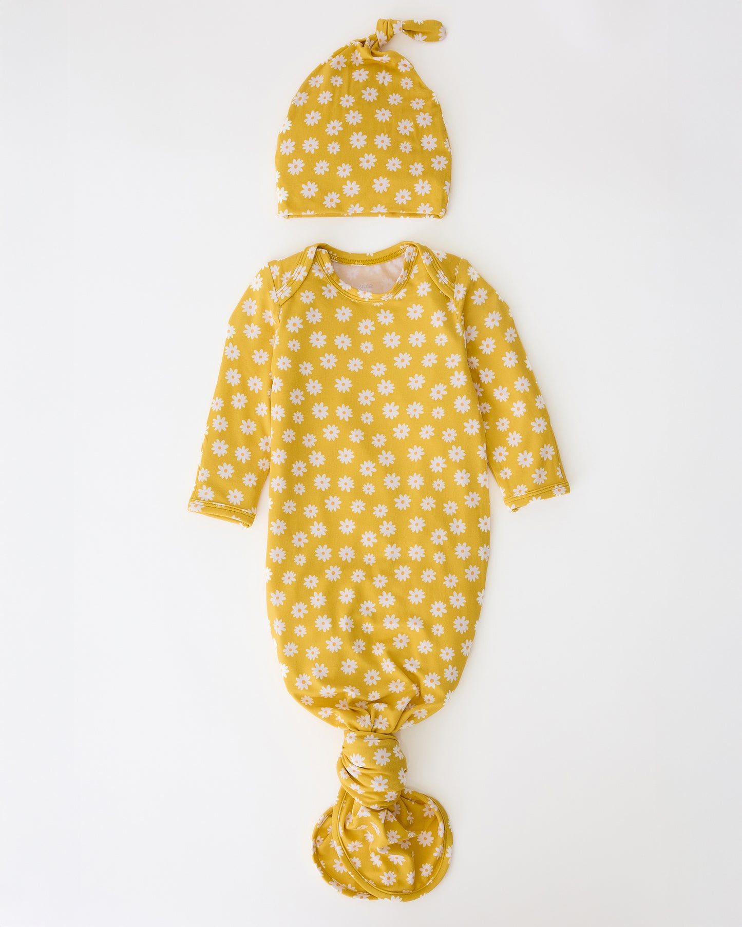 Bamboo Knotted Baby Gown & Hat in Yellow Daisies on a beige background