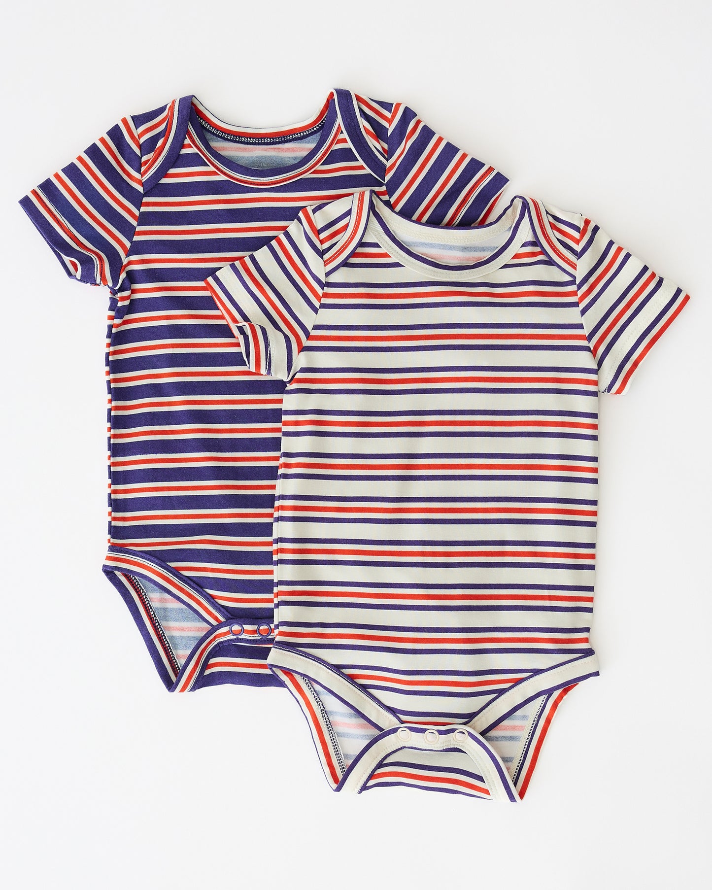 Baby Onesie Two-Pack in Red & Blue Stripe on a beige background