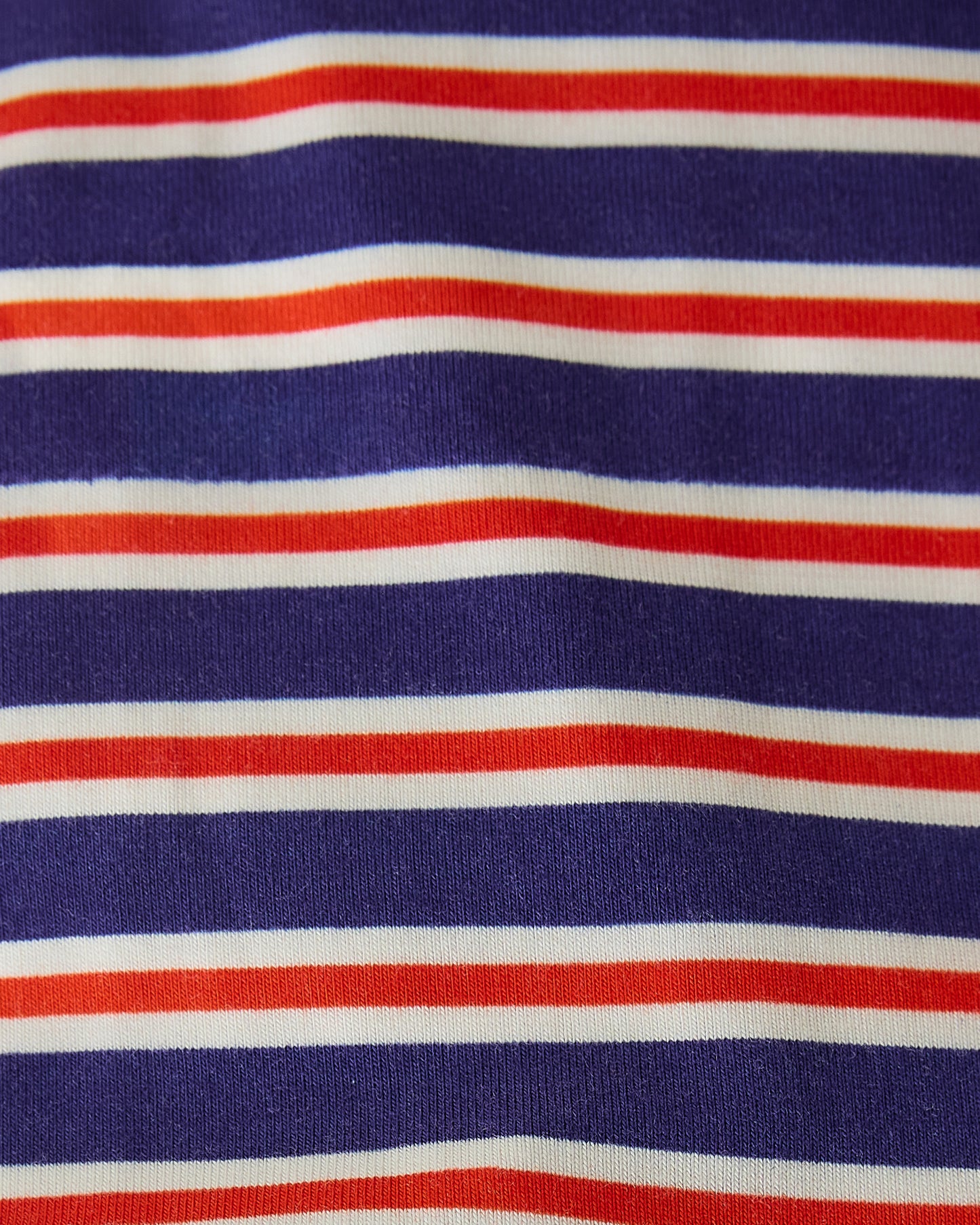 Close up of pattern on Baby Onesie Two-Pack in Red & Blue Stripe
