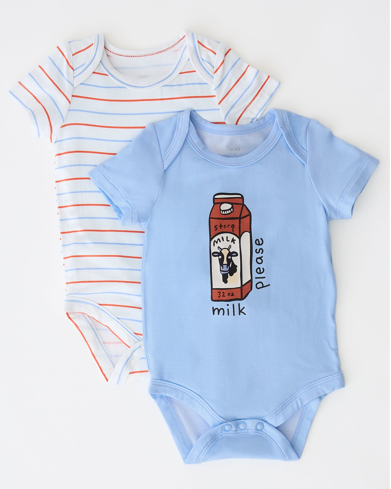 Baby Onesie Two-Pack in Milk Please on a beige background