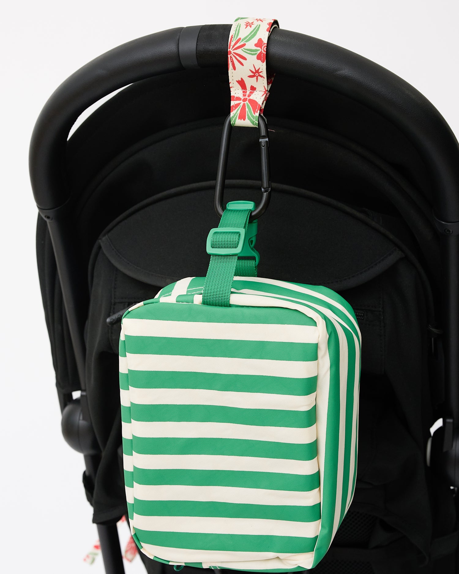 Stroller Party Clips (2-Pack) in Superbloom strapped to stroller handle and holding Mini Cooler in Green Stripe on a white background