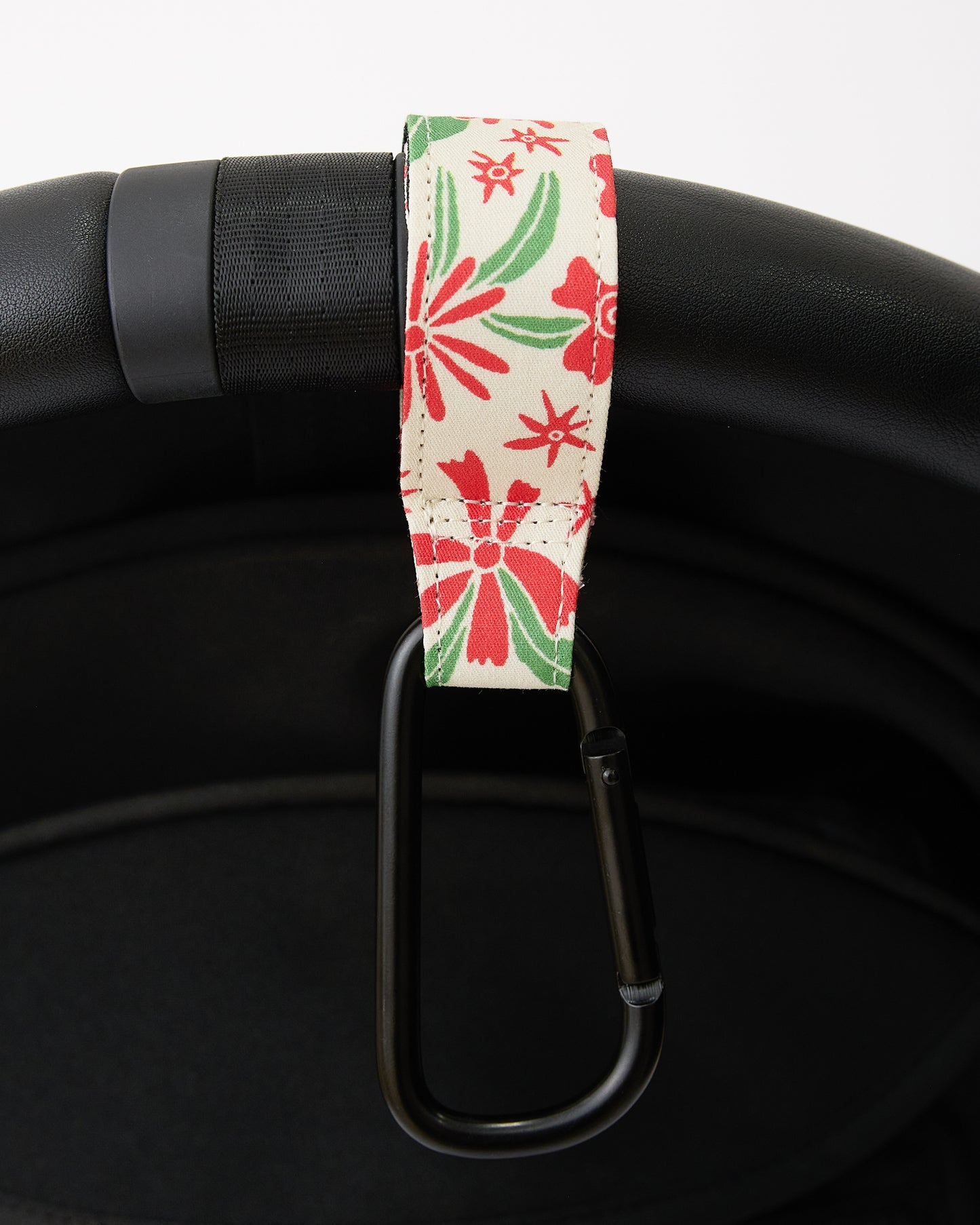 Stroller Party Clips (2-Pack) in Superbloom strapped to stroller handle on a white background