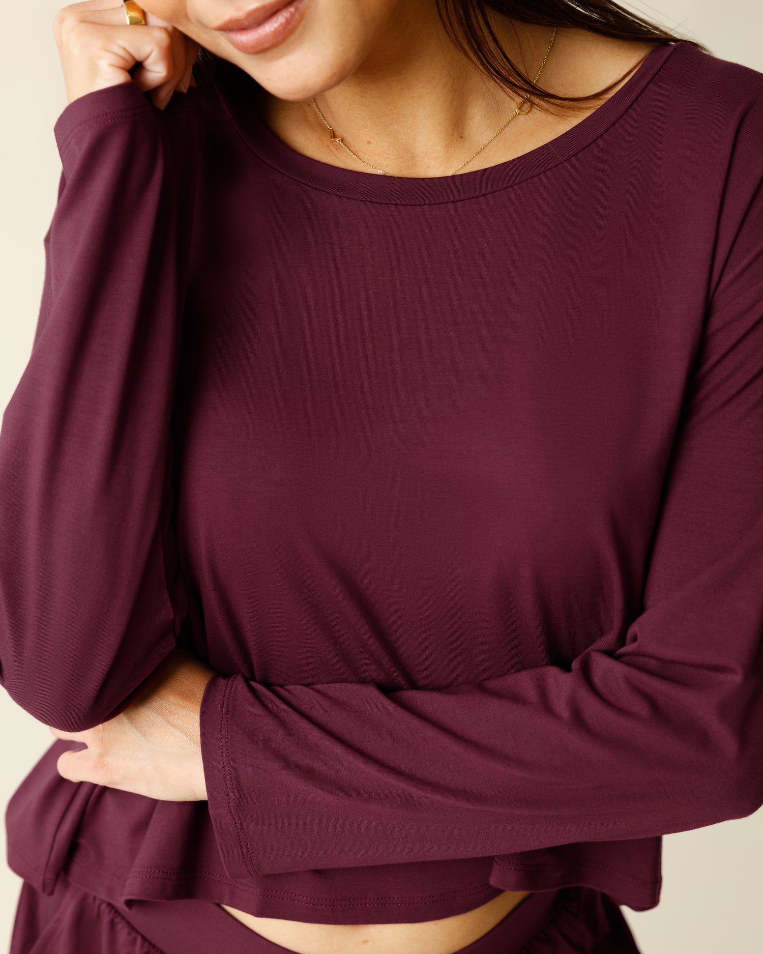Woman wearing the Aria Bamboo Casual Cropped Long Sleeve Top in Deep Burgundy, showing neckline and fabric detail