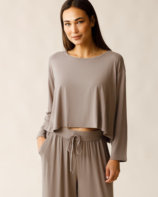 Woman wearing the Aria Bamboo Casual Cropped Long Sleeve Top in Taupe, paired with matching Aria Pant@model_info:Lisa is wearing a Small.