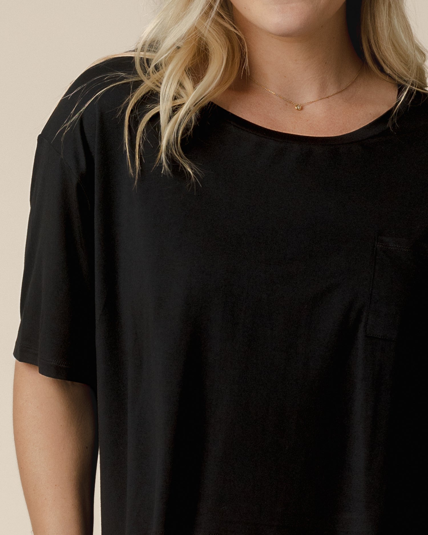 Close up detail view of model wearing the Aria Bamboo Casual Cropped Short Sleeve Top in Black