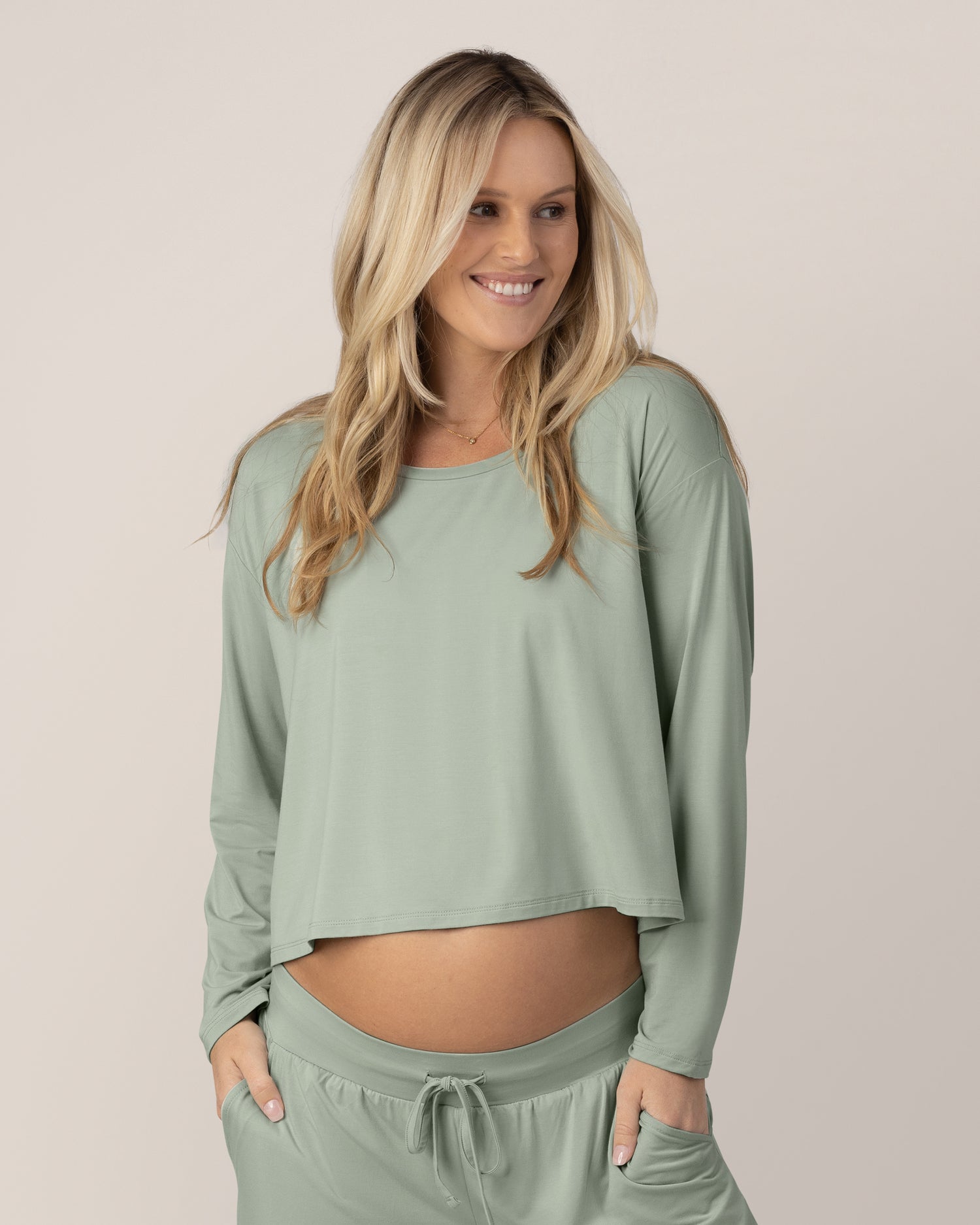 Pregnant model wearing the Aria Bamboo Casual Cropped Long Sleeve Top in Aqua Mist with the matching Aria Bamboo Casual Lounge Short@model_info:Maddy is wearing a Small.