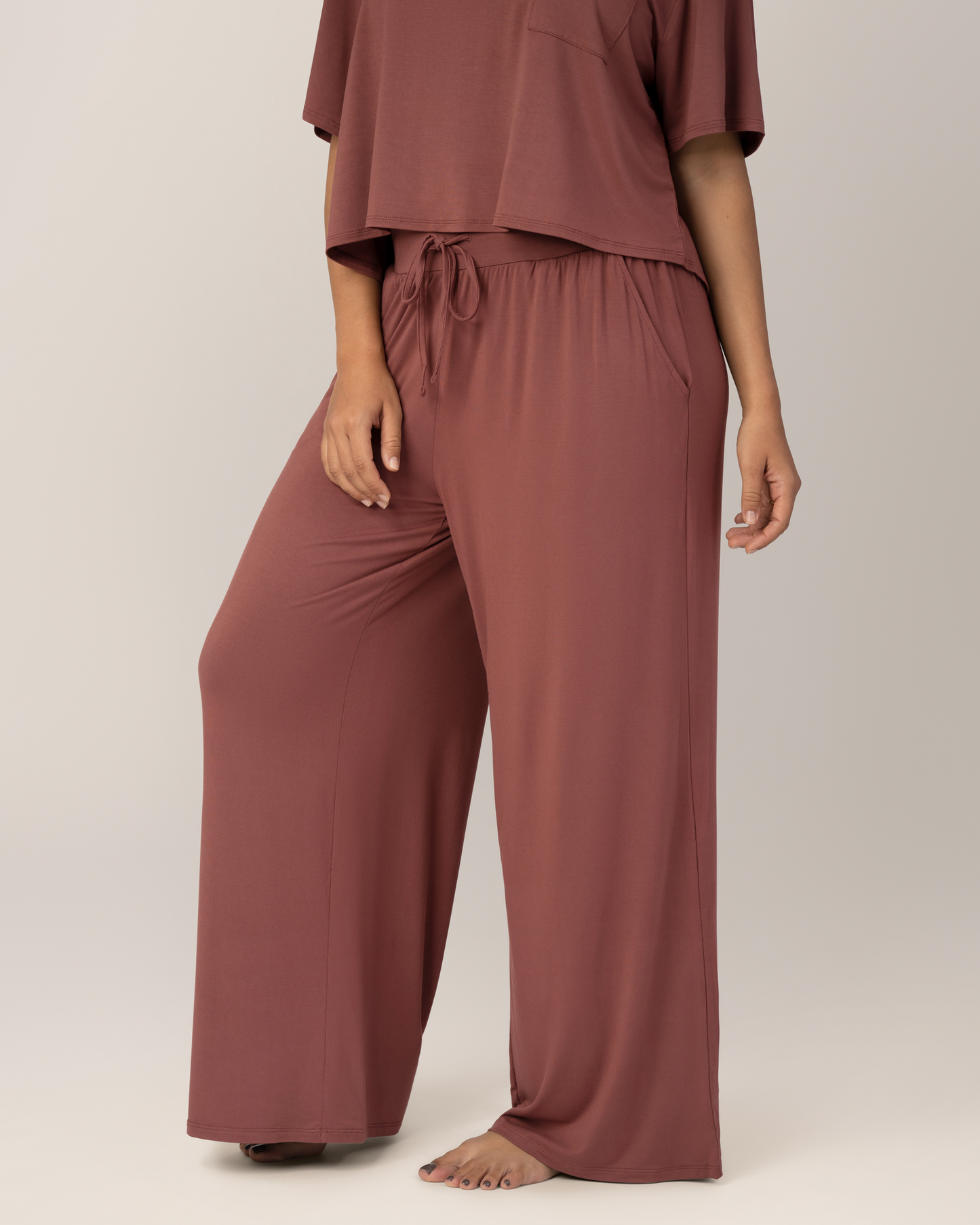 Close up side view of Front view of model wearing the  Aria Bamboo Casual Lounge Pant in Redwood, paired with matching Aria Bamboo Casual Cropped Short Sleeve Top