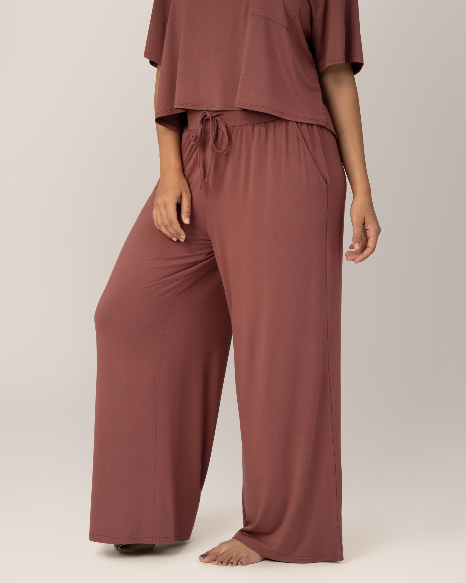 Close up side view of Front view of model wearing the  Aria Bamboo Casual Lounge Pant in Redwood, paired with matching Aria Bamboo Casual Cropped Short Sleeve Top