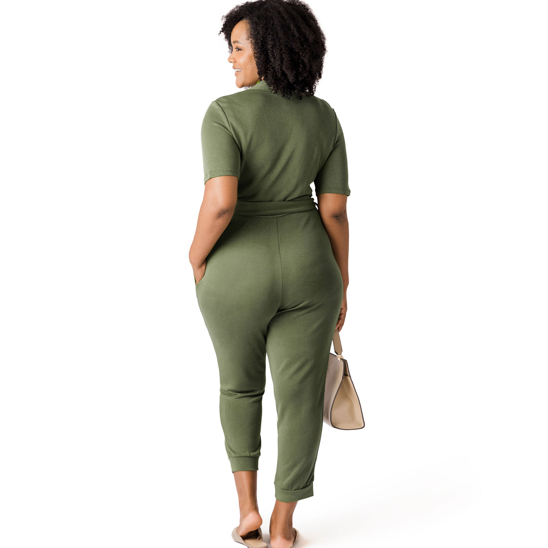 Back of a model wearing the Around the Clock Nursing Jumpsuit in olive