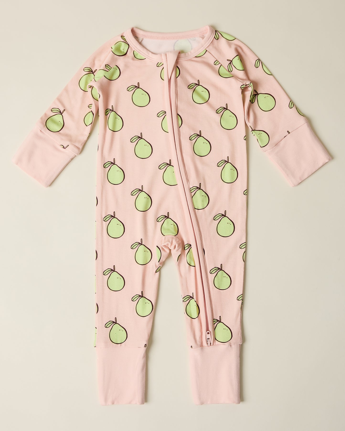 Bamboo Baby Pajama in pink pomelo on a beige background