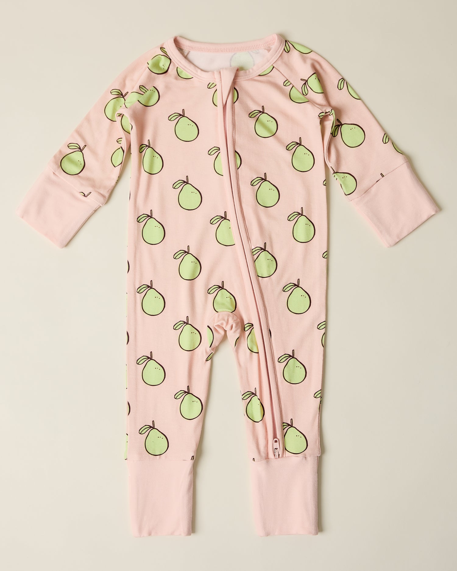 Bamboo Baby Pajama in pink pomelo on a beige background