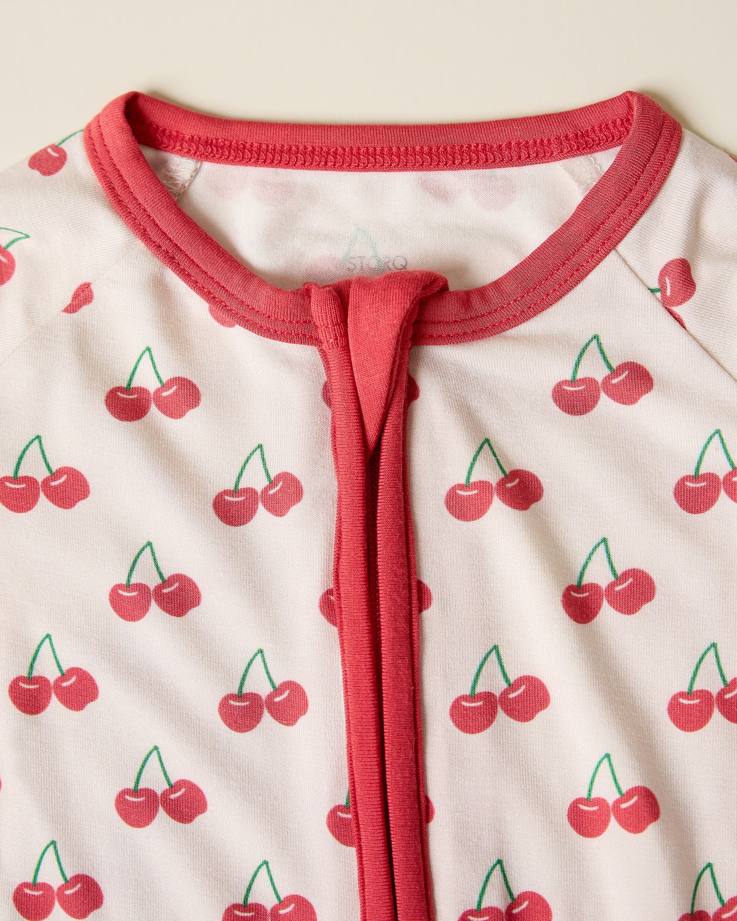 Close up of Bamboo Baby Pajama with cherry pattern