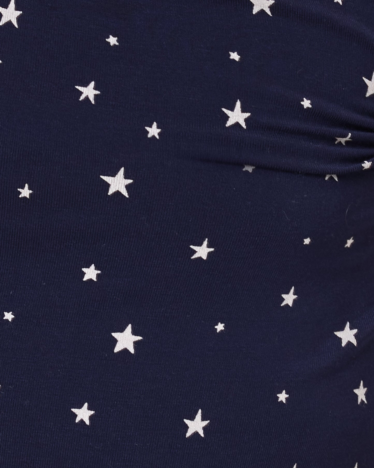 Close up of baby wearing the Bamboo Baby Two-Piece Pajama Set in Navy Stars print