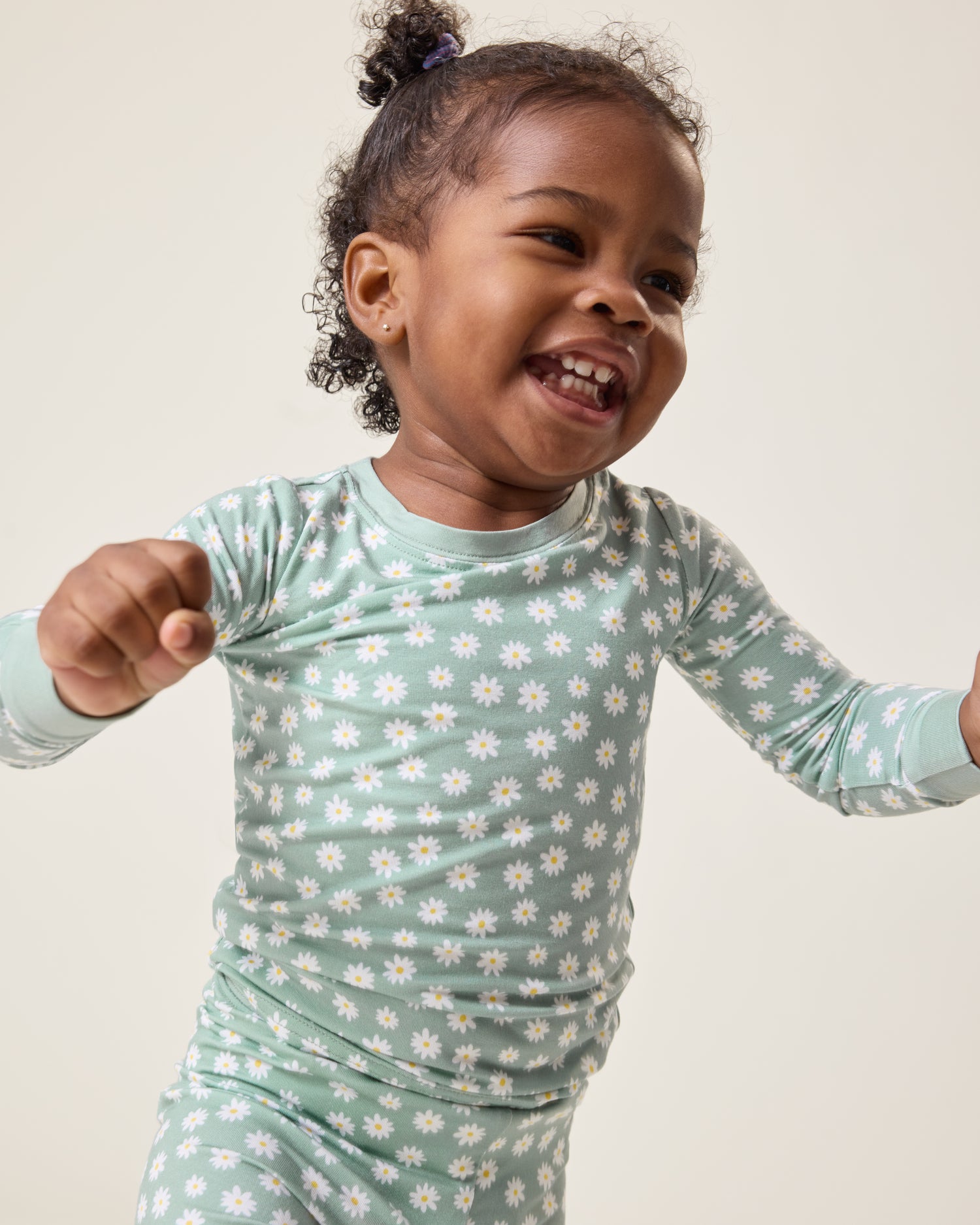 Baby wearing the Bamboo Baby Two-Piece Pajama Set in Sage Daisies print