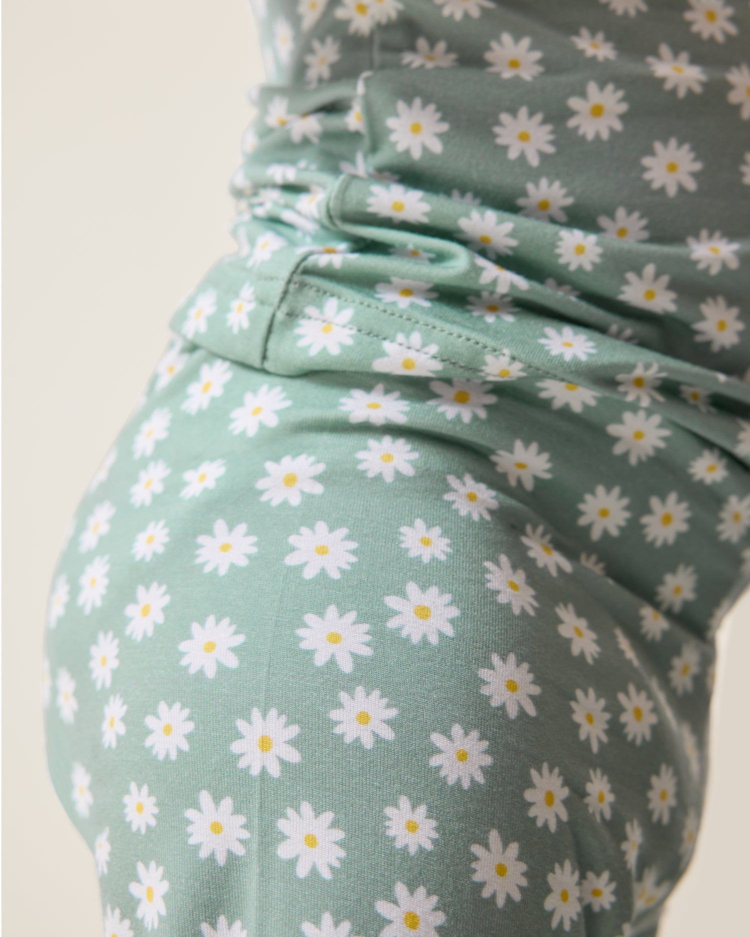 Close up of Baby wearing the Bamboo Baby Two-Piece Pajama Set in Sage Daisies print