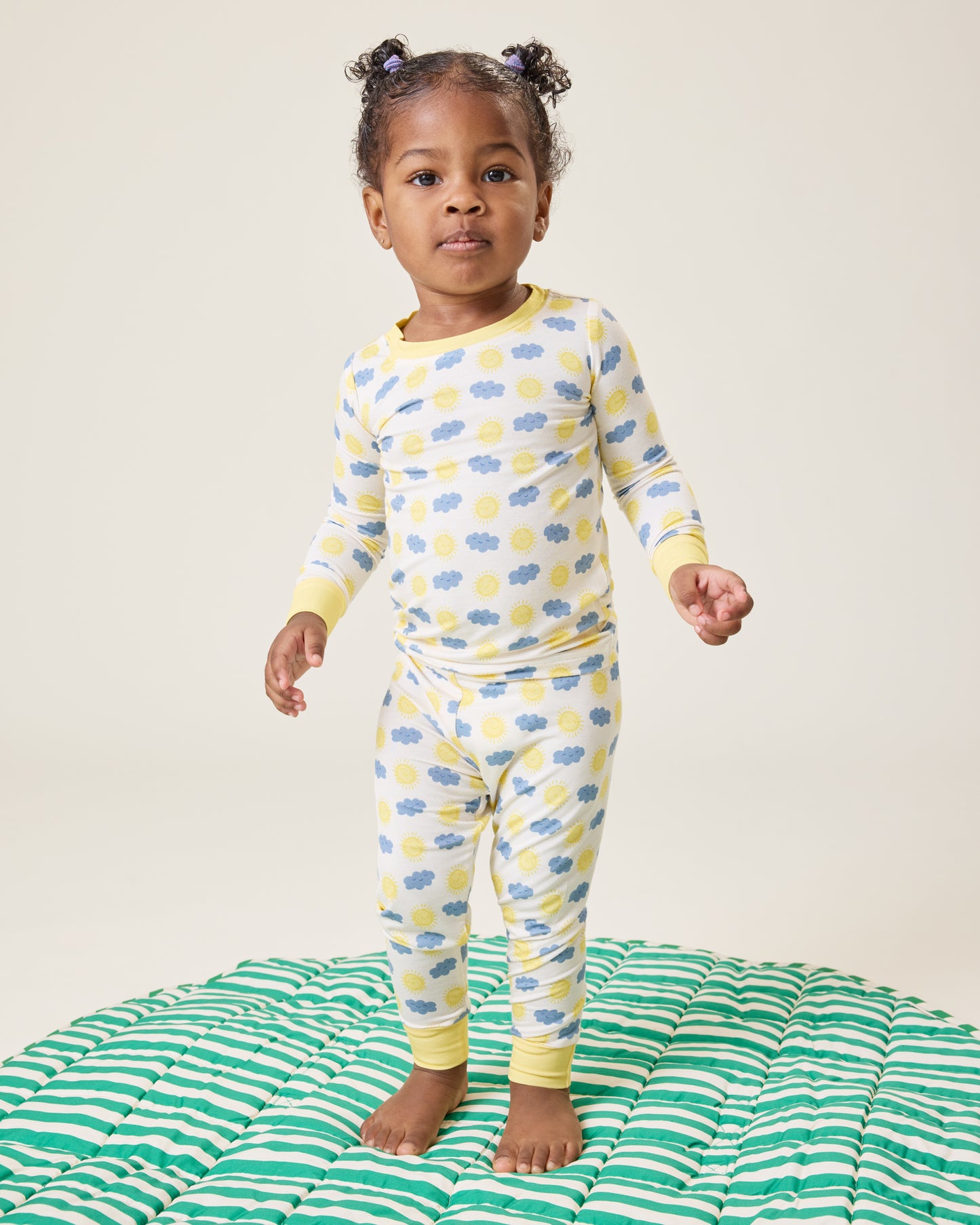 Baby wearing the Bamboo Baby Two-Piece Pajama Set in Sunny Day print@model_info:Harper is wearing 18-24 months.