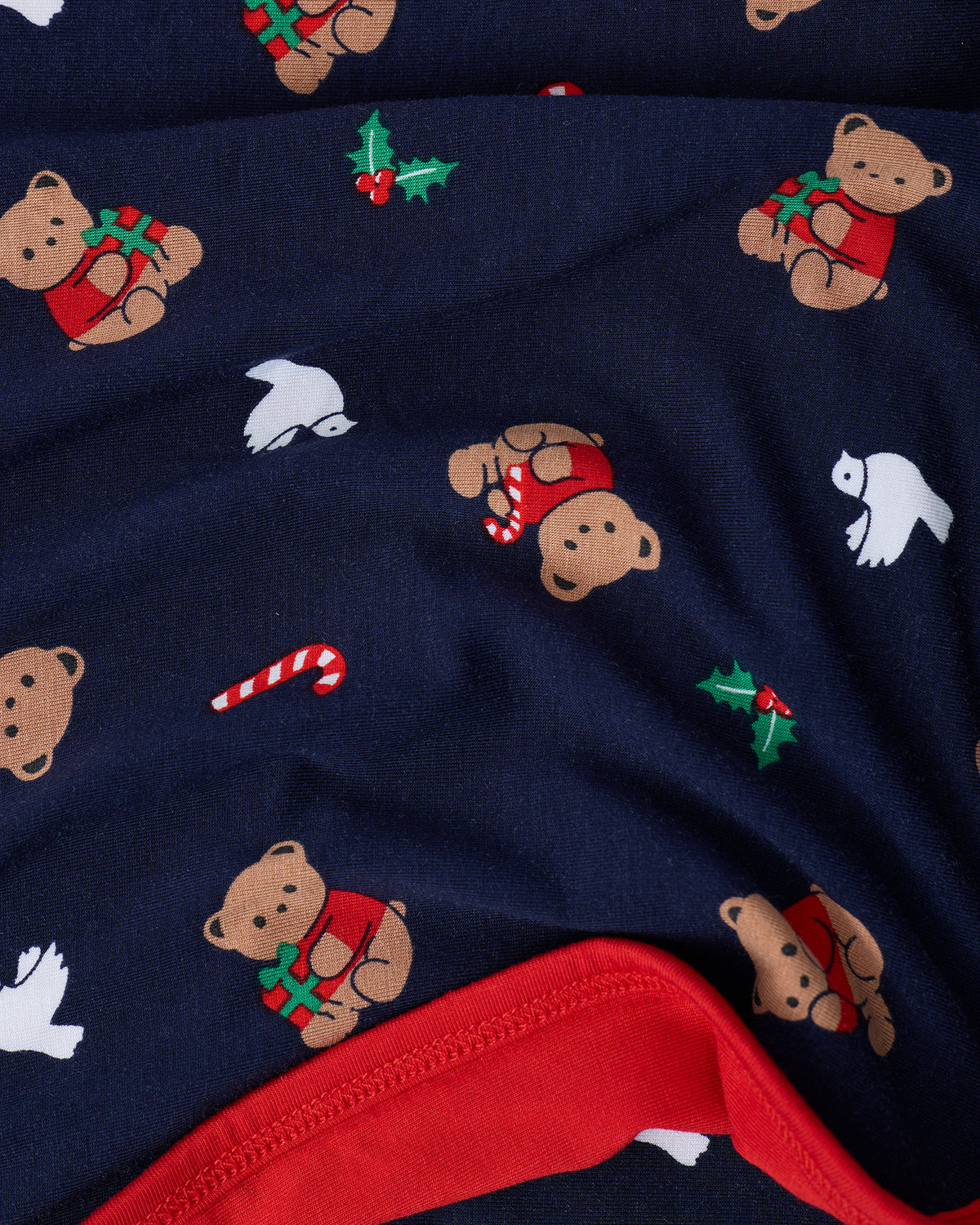 Bamboo Blanket in Bearing Gifts folded to show red reversible design.