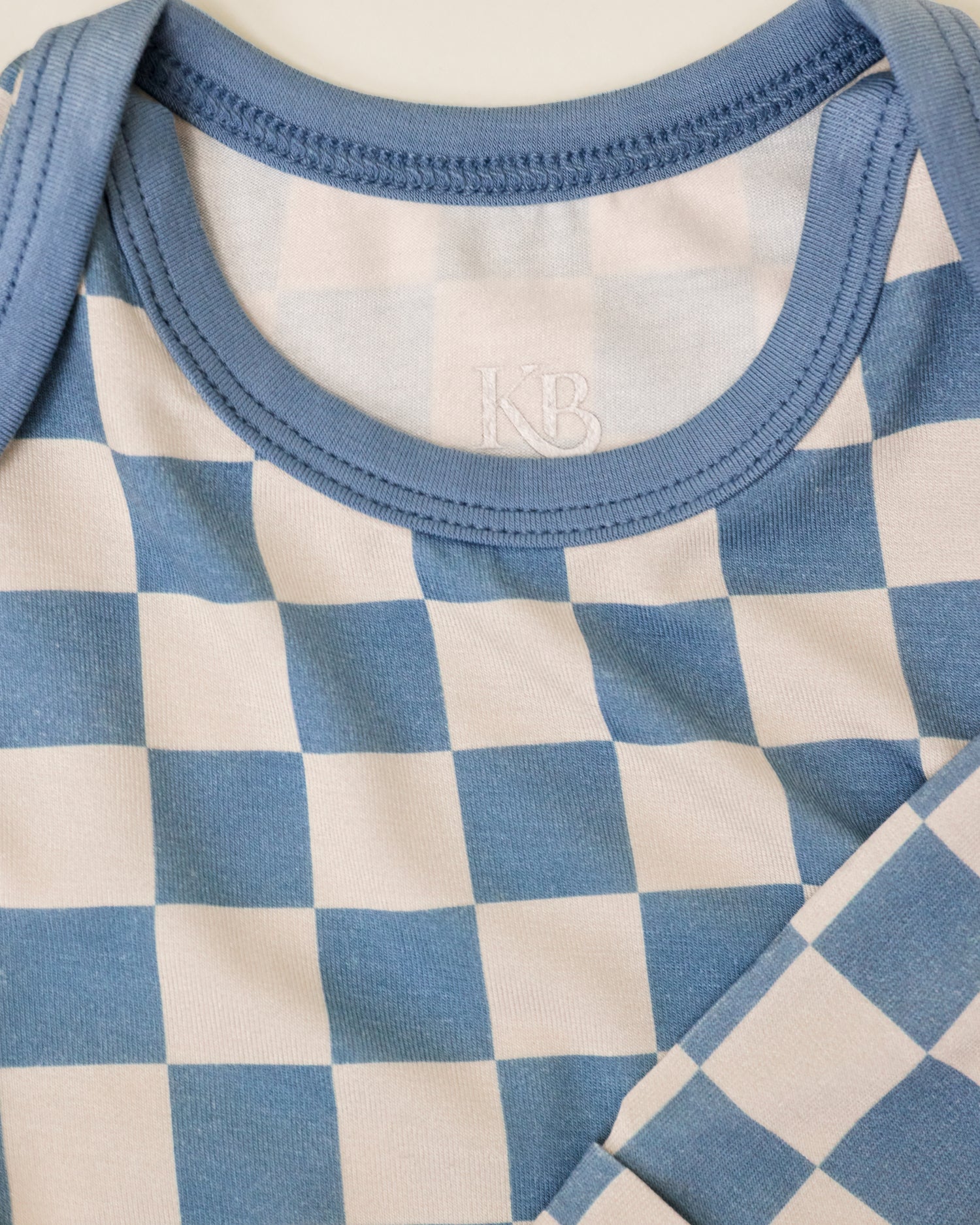Close up of Bamboo Knotted Baby Gown & Hat in Blue Checker print
