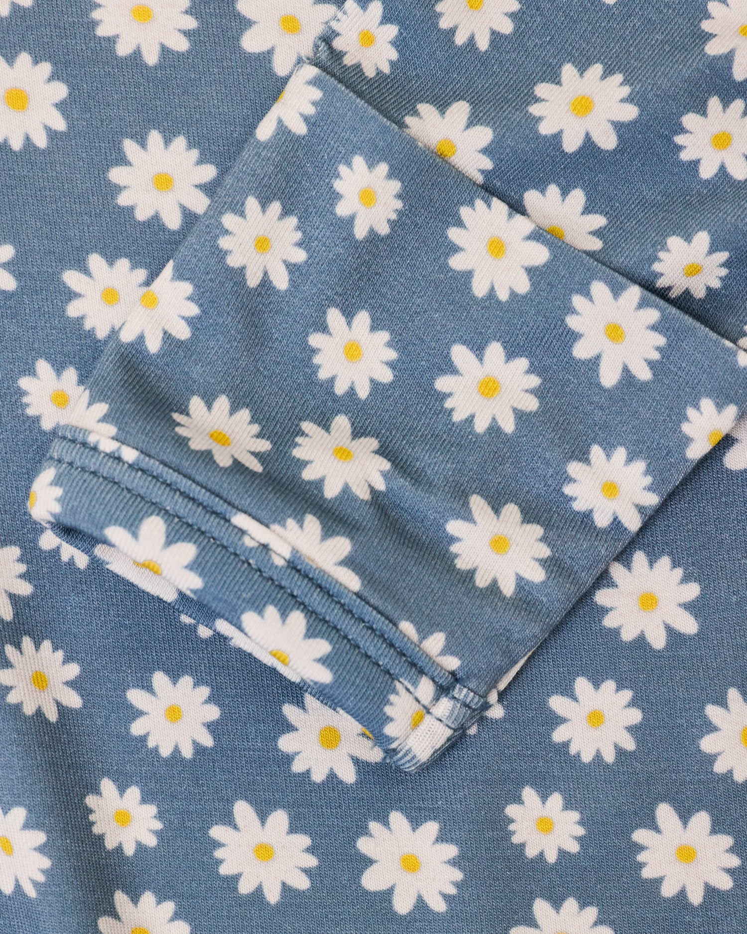 Close up of Bamboo Knotted Baby Gown & Hat in Blue Daisies print