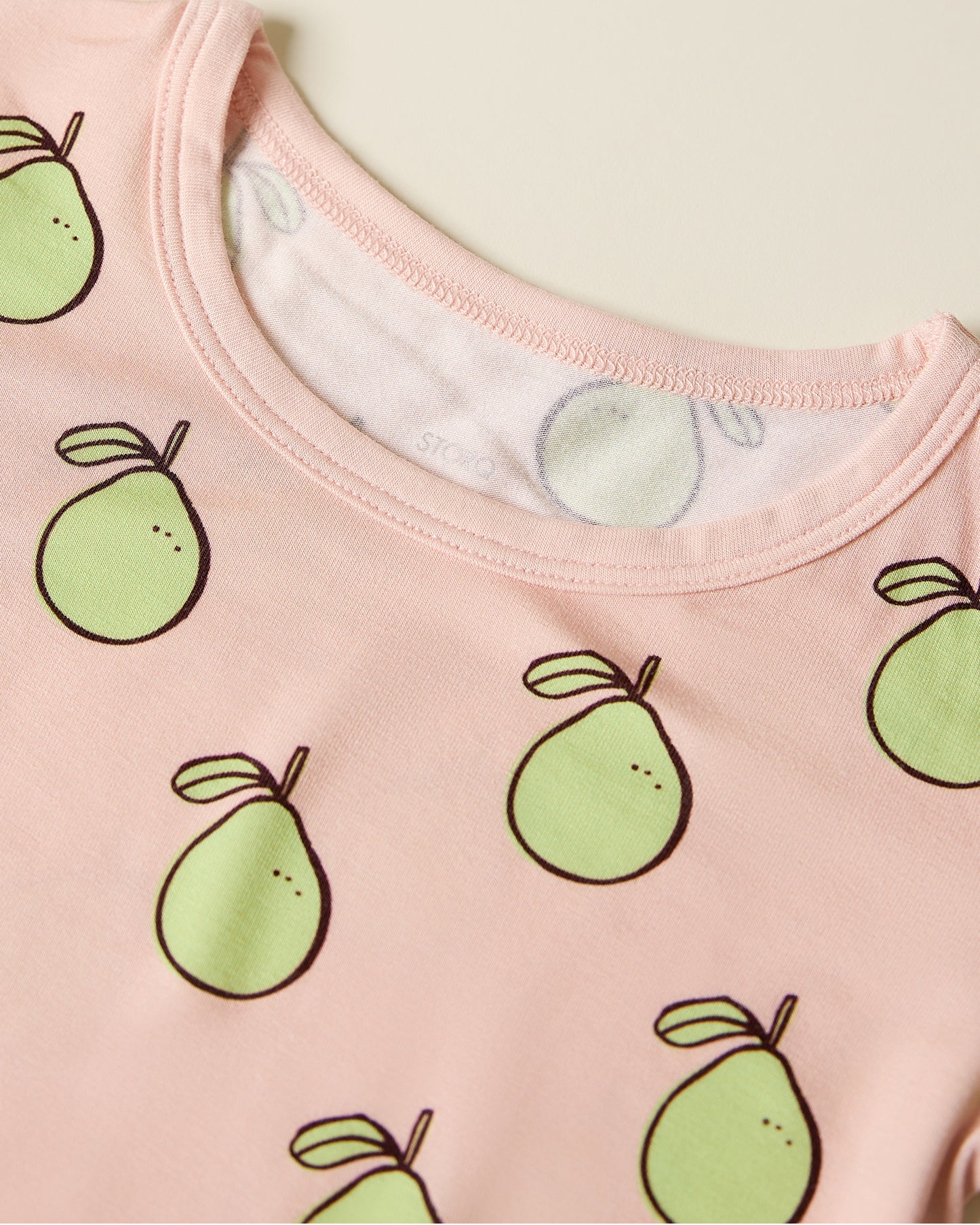 Close up of the Bamboo Short Sleeve & Shorts Set in pink pomelo