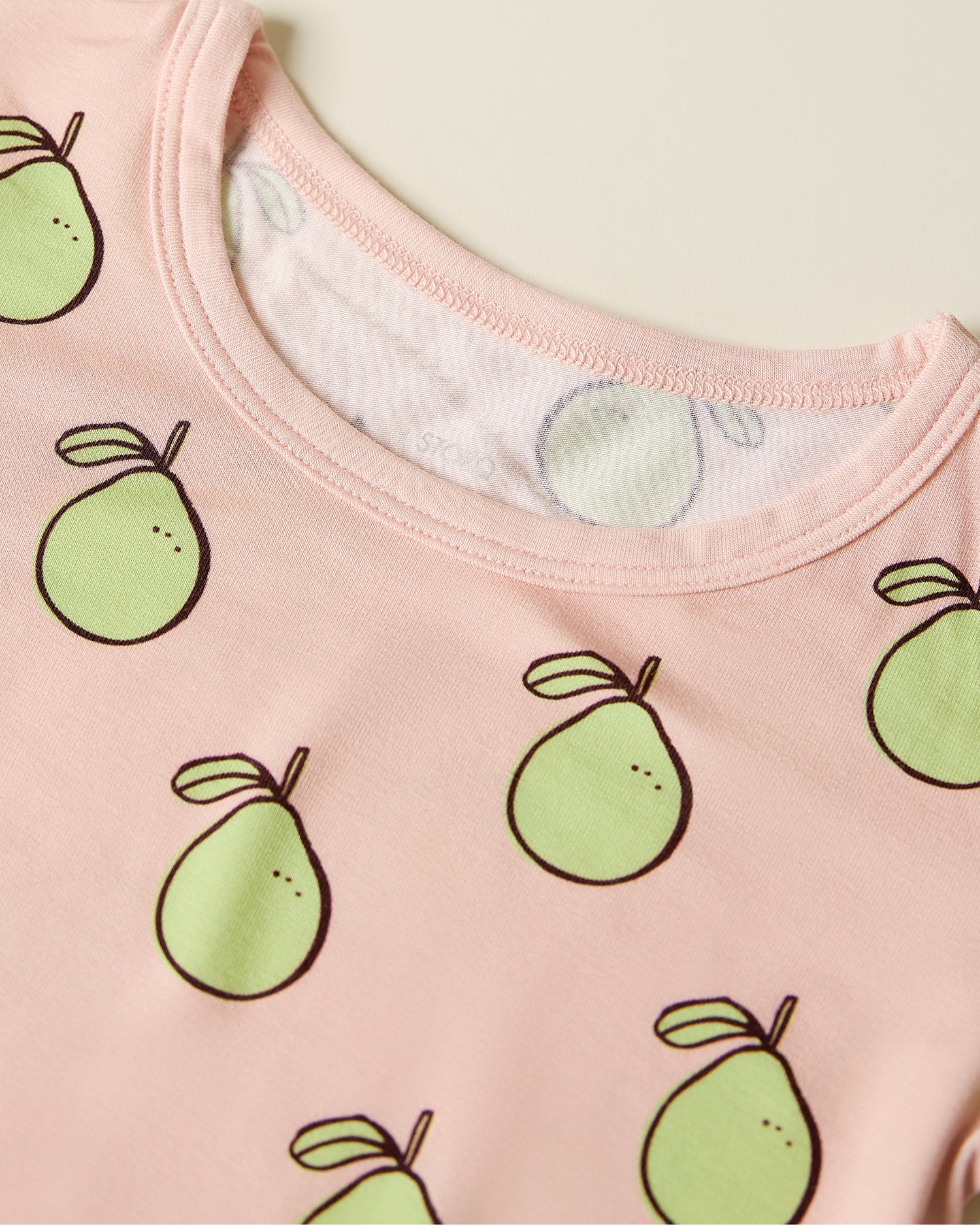 Close up of the Bamboo Short Sleeve & Shorts Set in pink pomelo