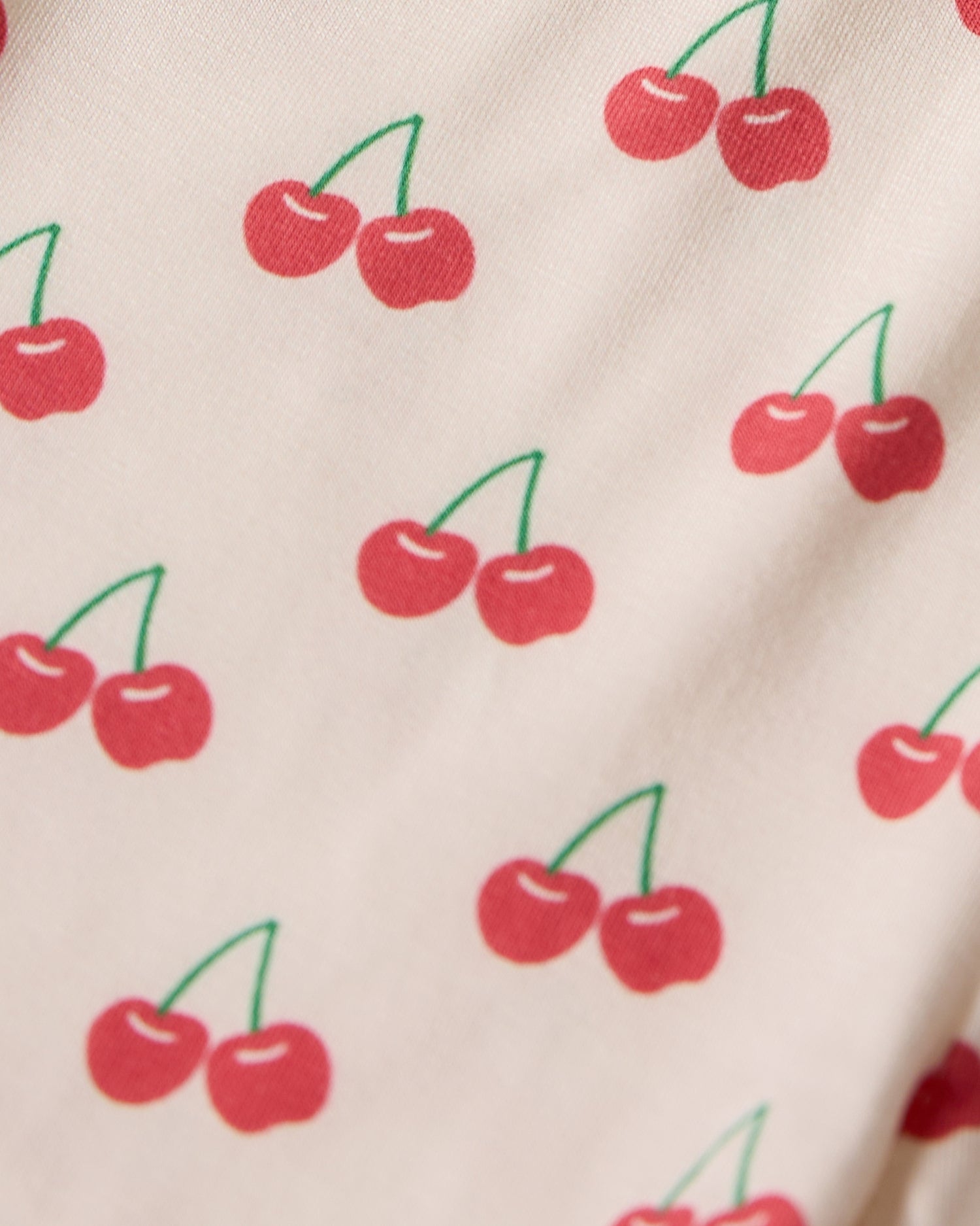 Pattern of red cherries on a beige background