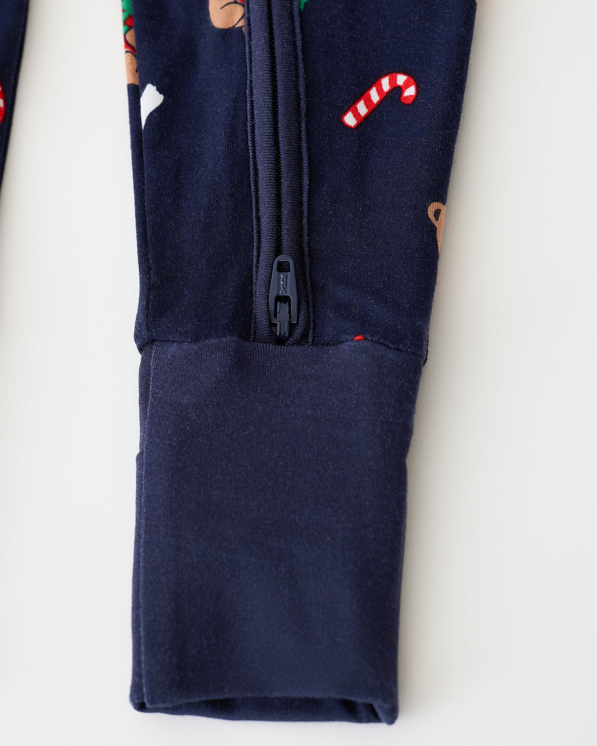 Close up of pant detail on Bamboo Baby Pajama in Bearing Gifts on an off white background.