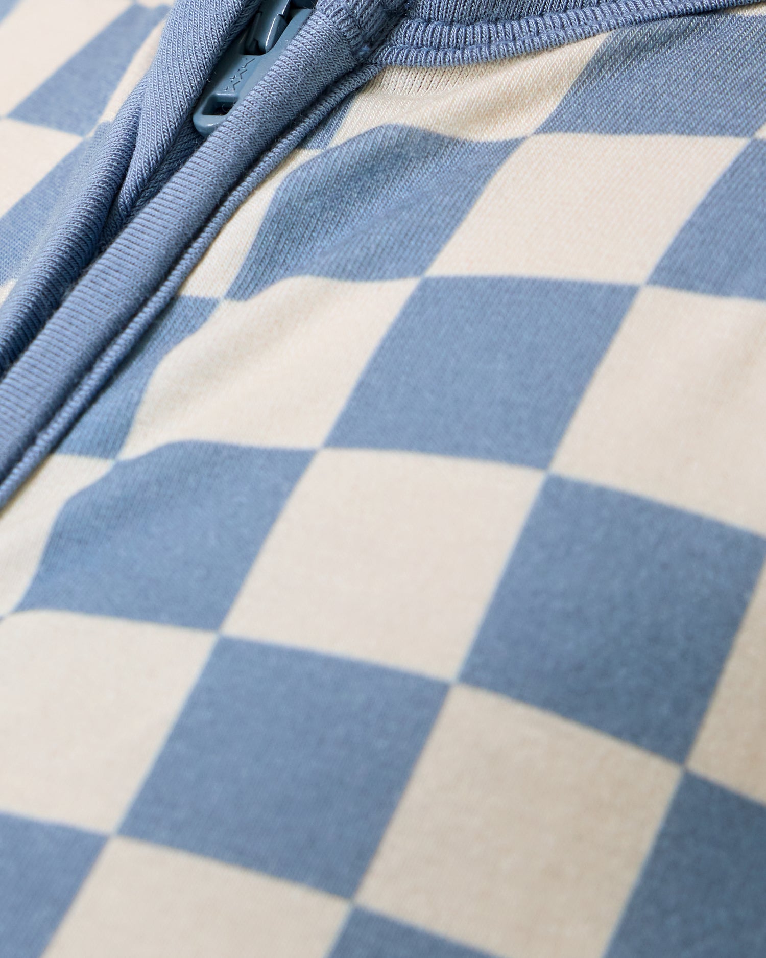 Close up of Baby wearing the Bamboo Baby Pajama in Blue Checker print
