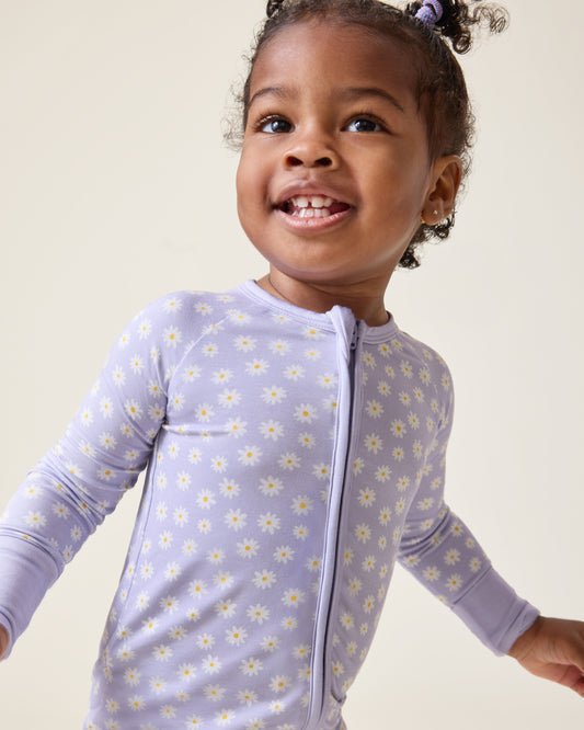 Baby wearing the Bamboo Baby Pajama in Purple Daisies print@model_info:Harper is wearing 18-24 months.