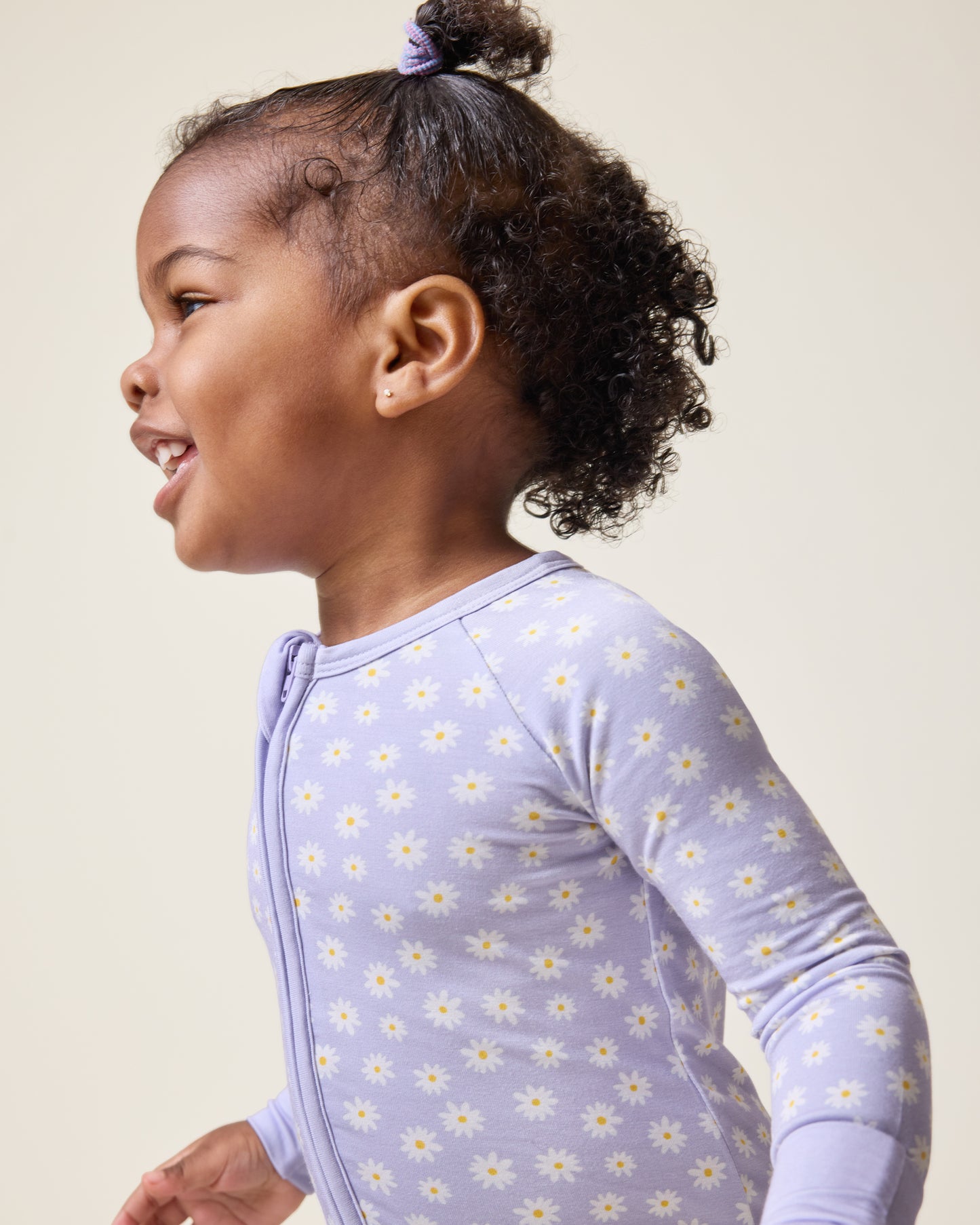 Baby wearing the Bamboo Baby Pajama in Purple Daisies print