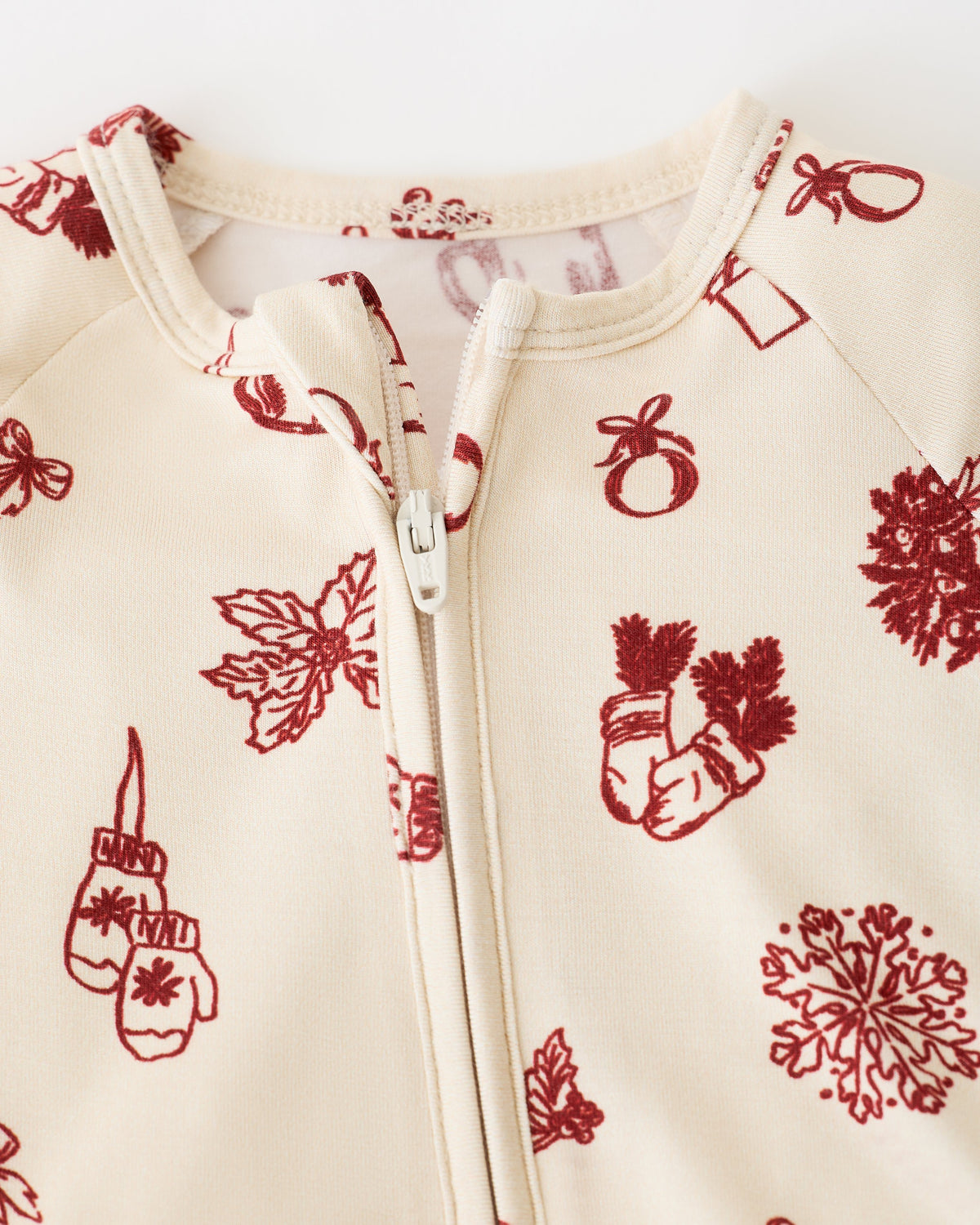Close up of collar detail on Bamboo Baby Pajama in Cozy Day pattern, on an off white background.