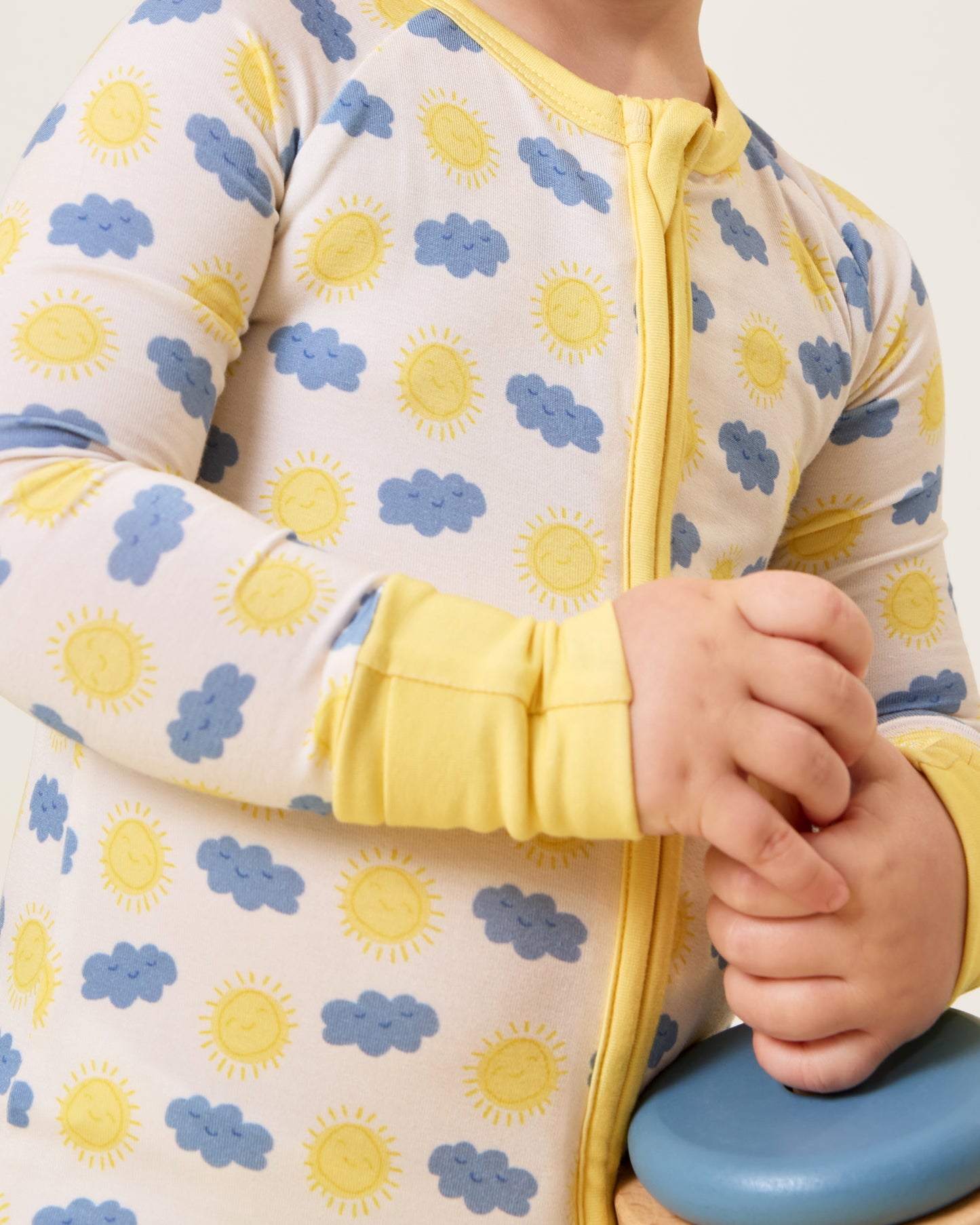 Close up of Baby wearing the Bamboo Baby Pajama in Sunny Day print