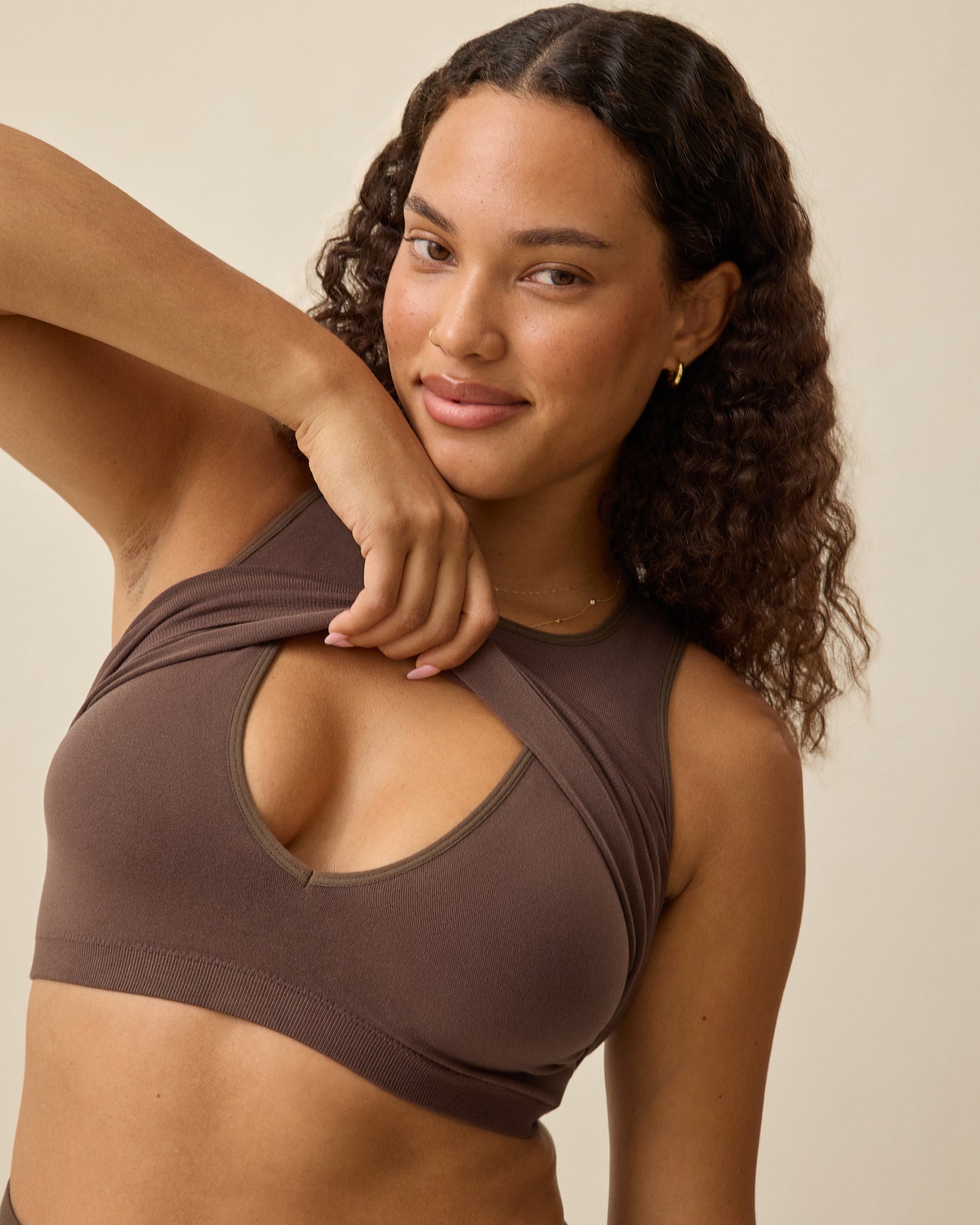 Model wearing Sublime® Bamboo Maternity & Nursing Longline Bra Top in Chocolate, displaying inner shelf bra underneath, on a beige background